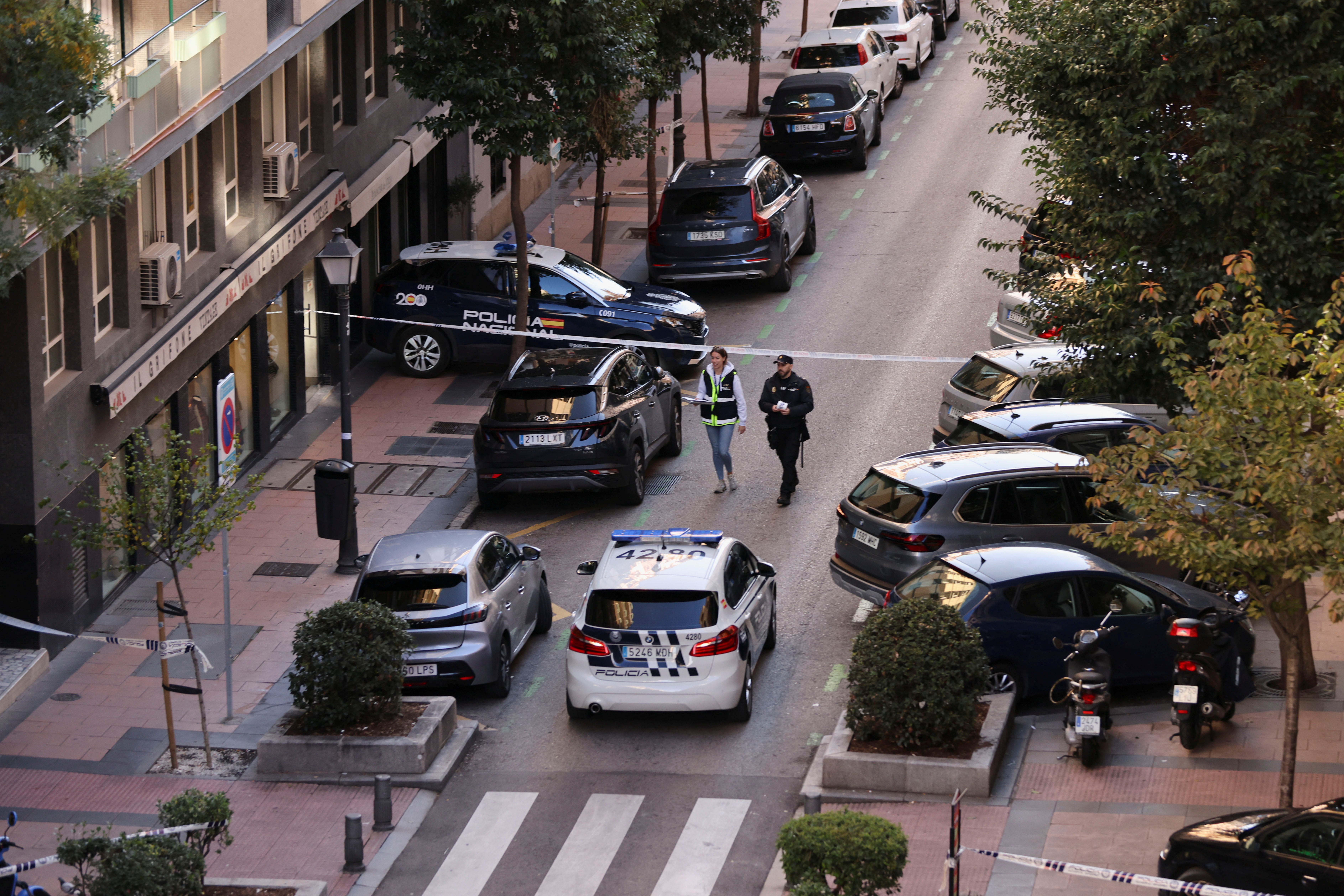 Police work at the site where Alejo Vidal-Quadras, former head of Spain's People's Party in the Catalonia region, was shot in the face