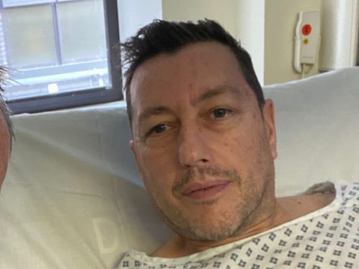 Neil Inman says surgeons told him he almost died after he was attacked by a dog outside his home