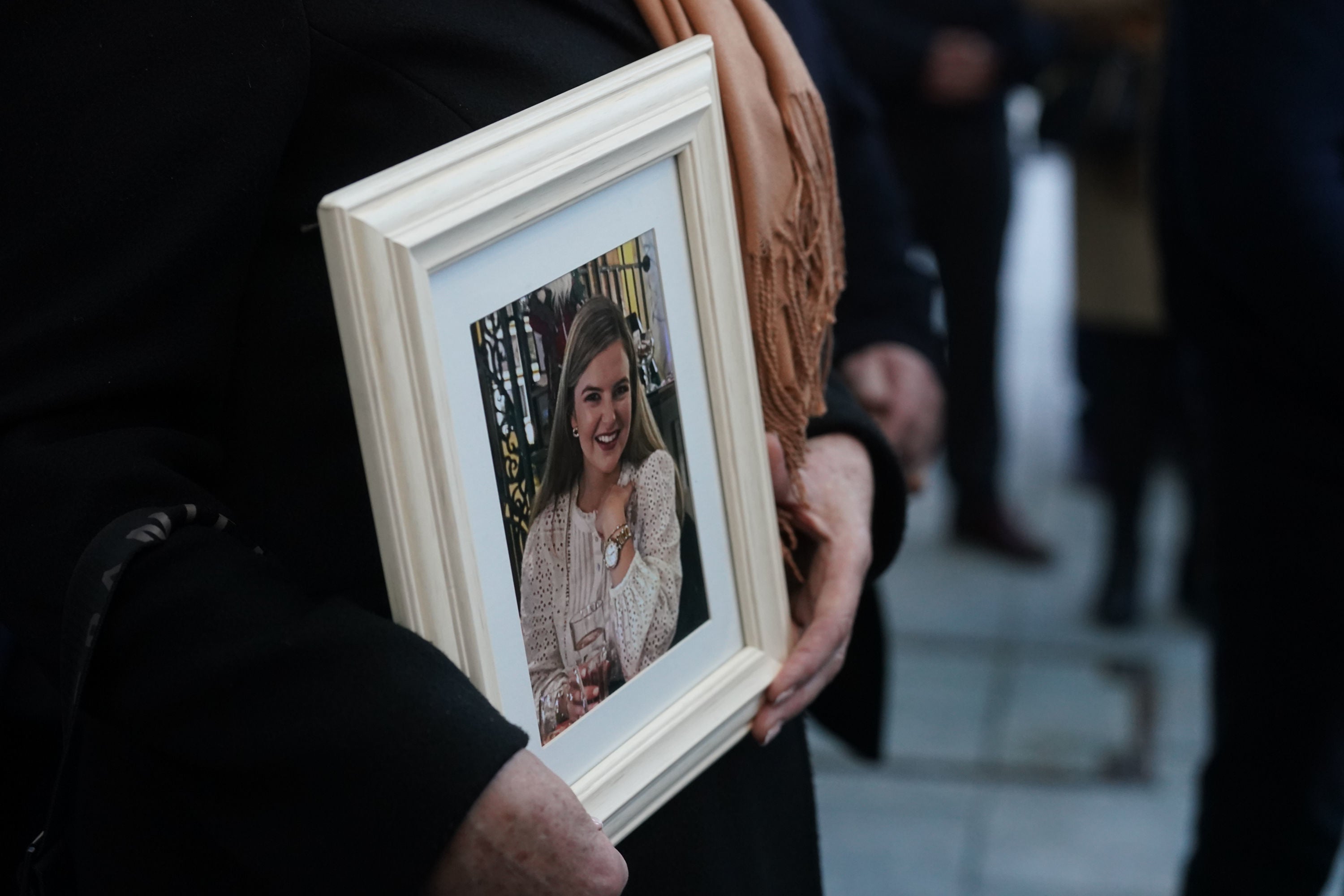 Ashling’s mother Kathleen, holds a framed photograph of her daughter