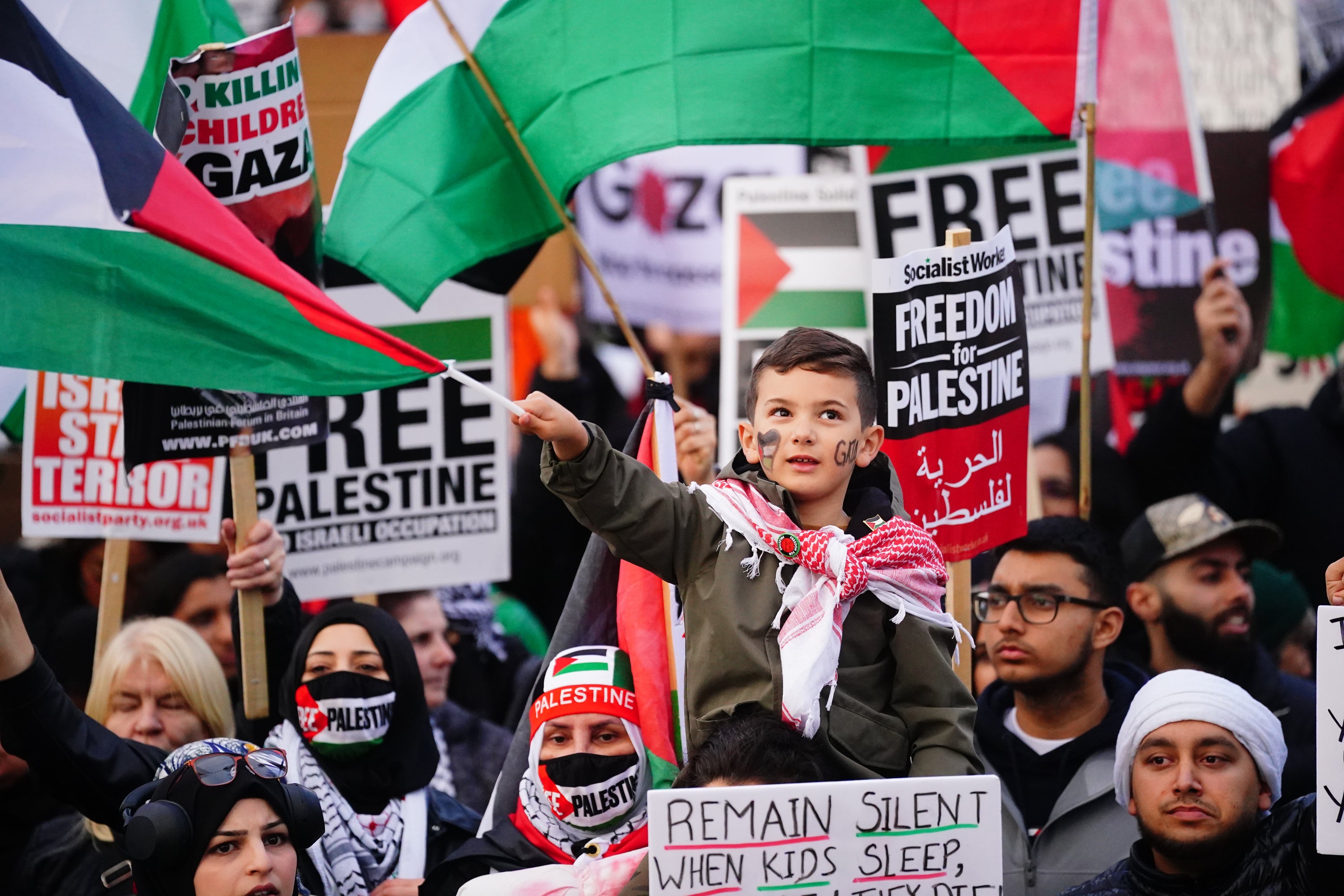 People at a rally in Trafalgar Square, London, during Stop the War coalition's call for a Palestine ceasefire.