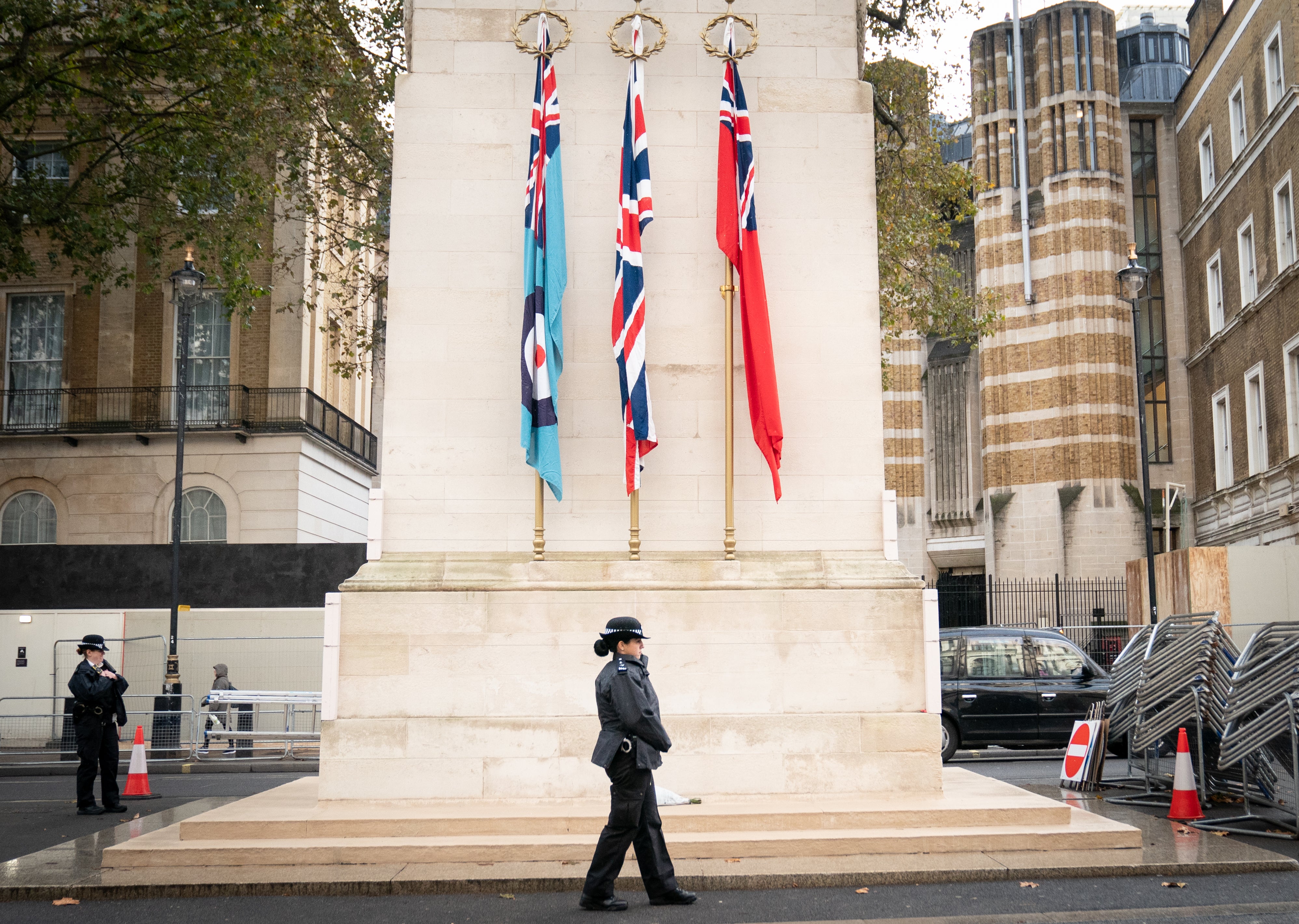 An officer from the Metropolitan Police on duty beside the Cenotaph on Whitehall, central London, ahead of marches planned for the centre of the city on Saturday