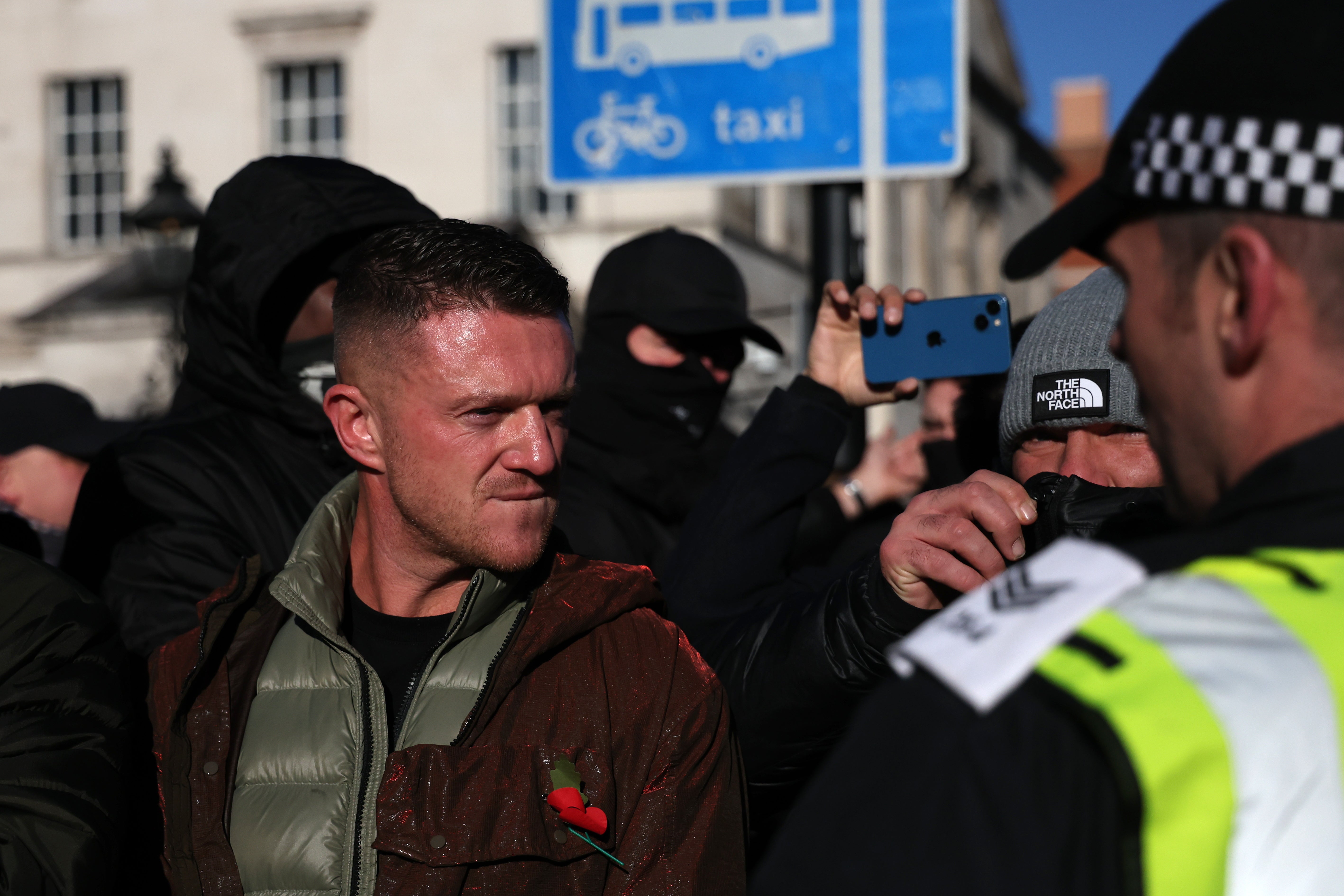 Tommy Robinson leads far-right protesters