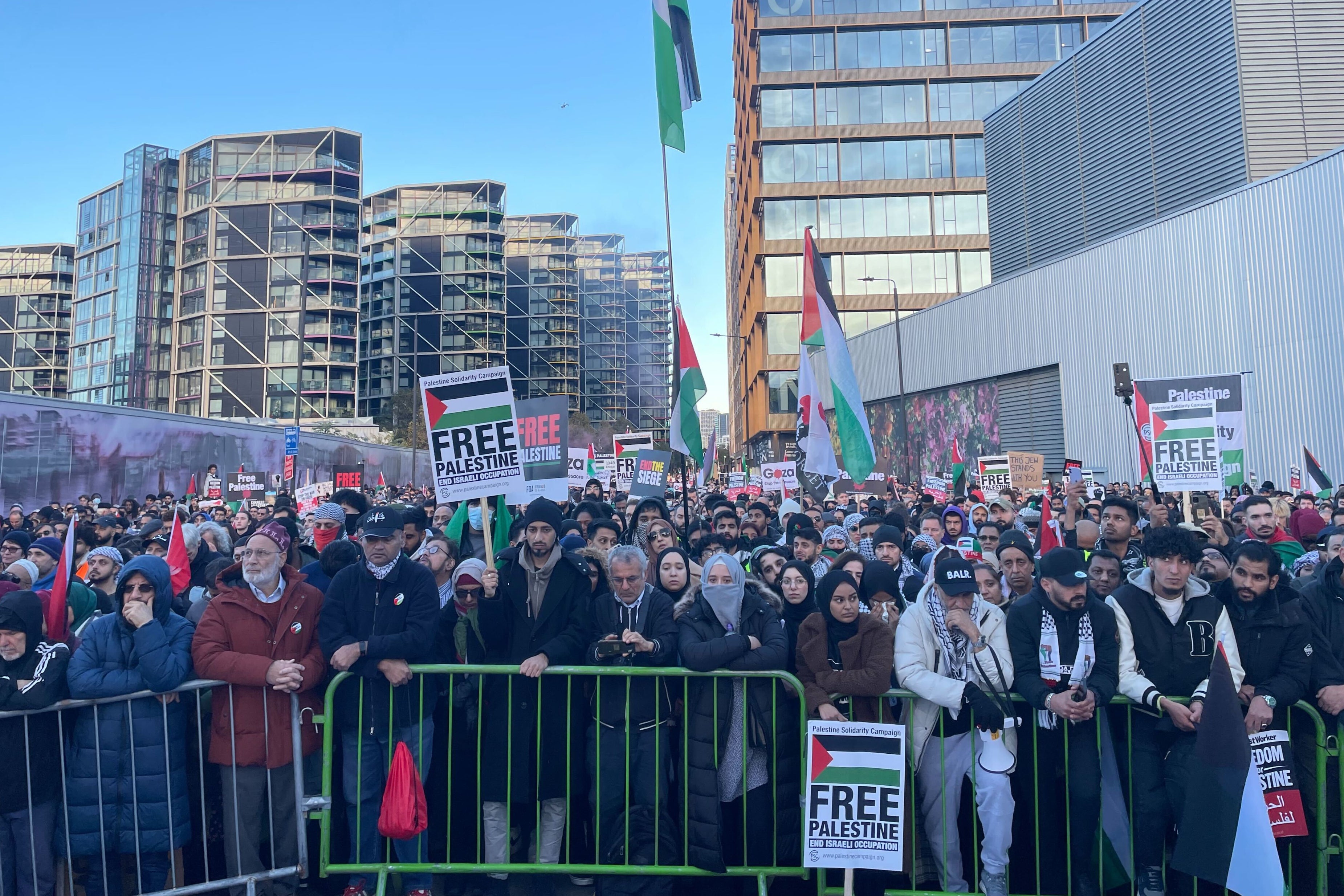 Protesters stifle tears during a two-minute silence outside the US embassy in south London on Saturday