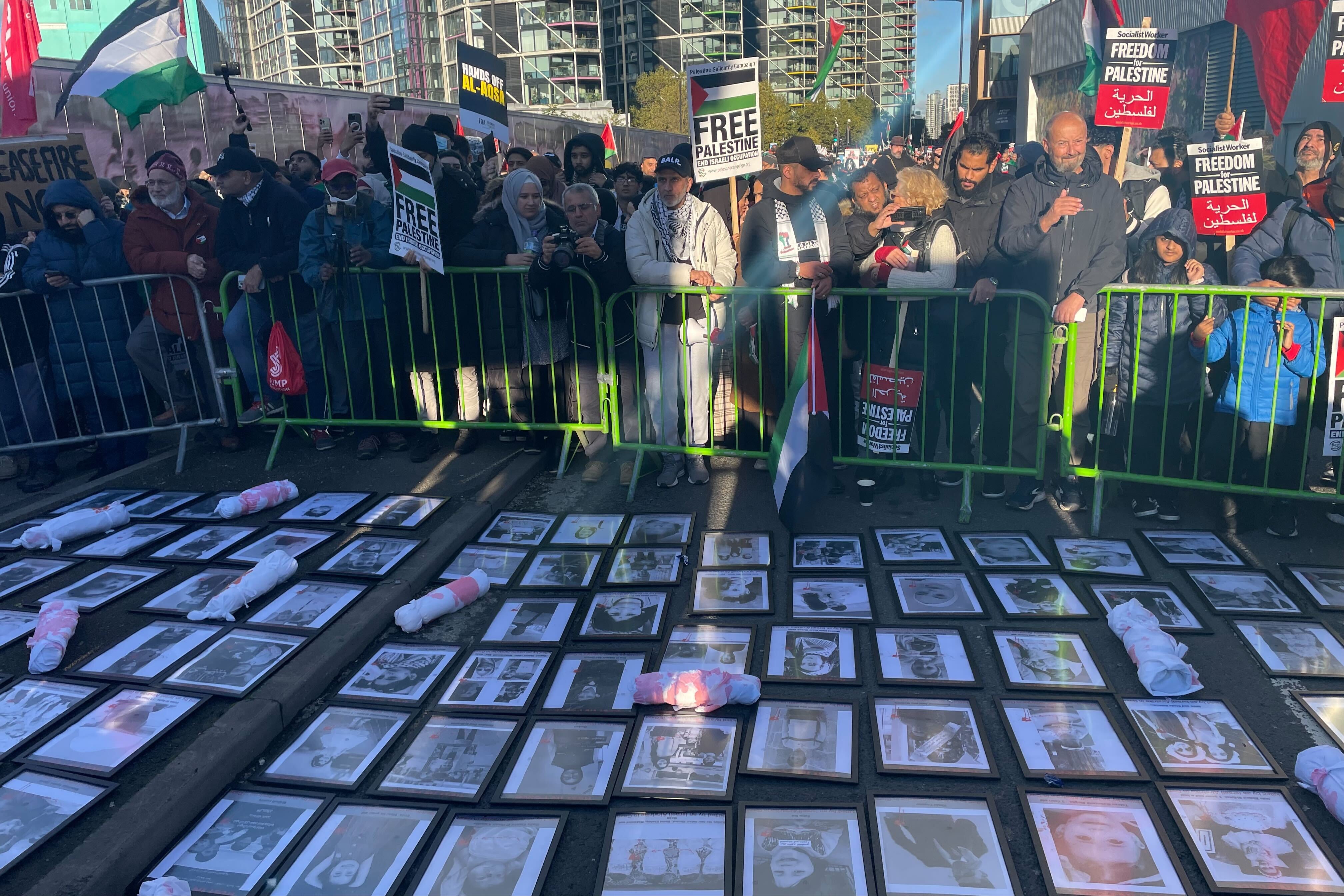 Pictures showing young children killed in Gaza over the last five weeks line the street outside the US embassy