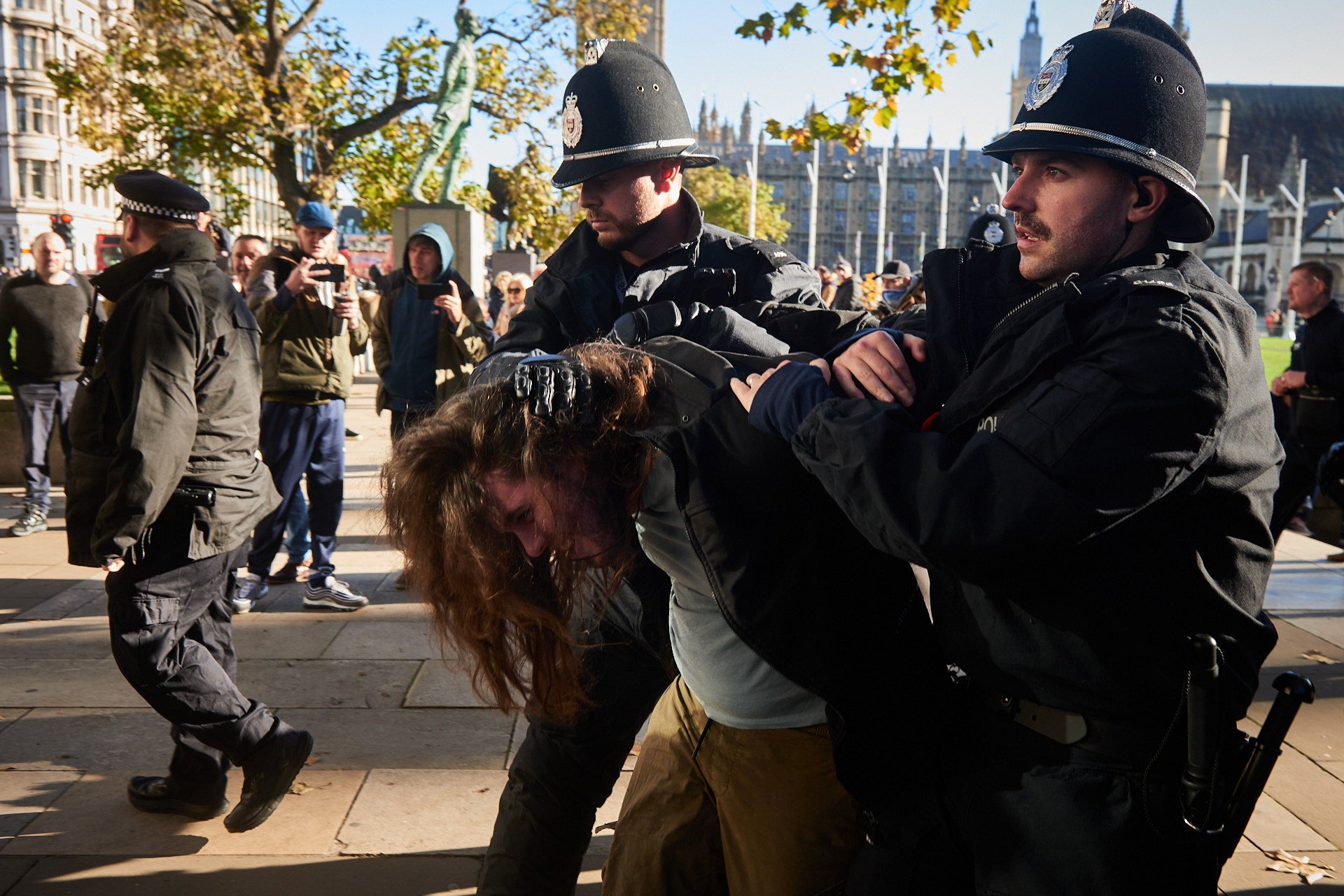 A counterprotester is arrested in Parliament square on Saturday morning