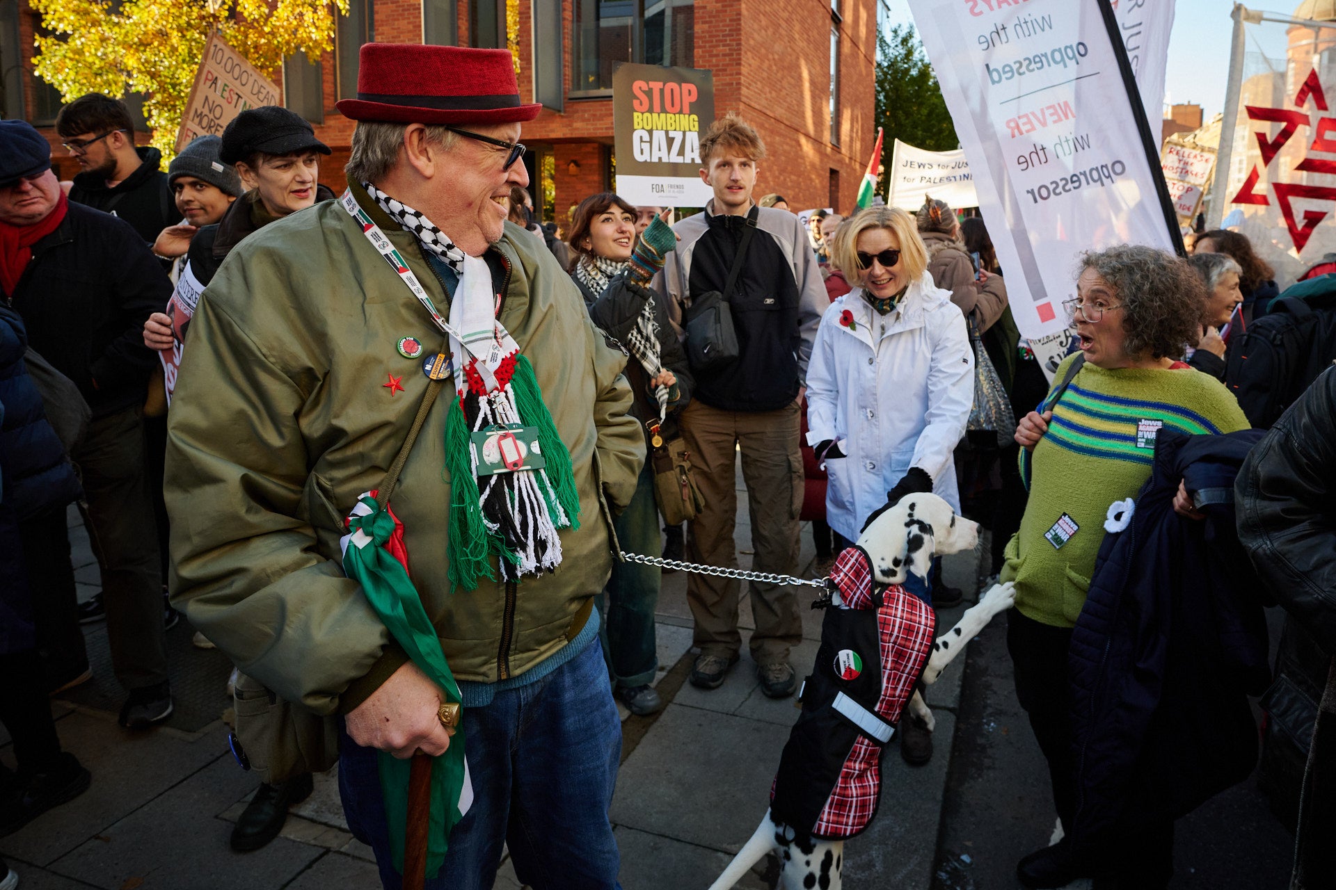 A protester with his dog on the march near Vauxhall Bridge