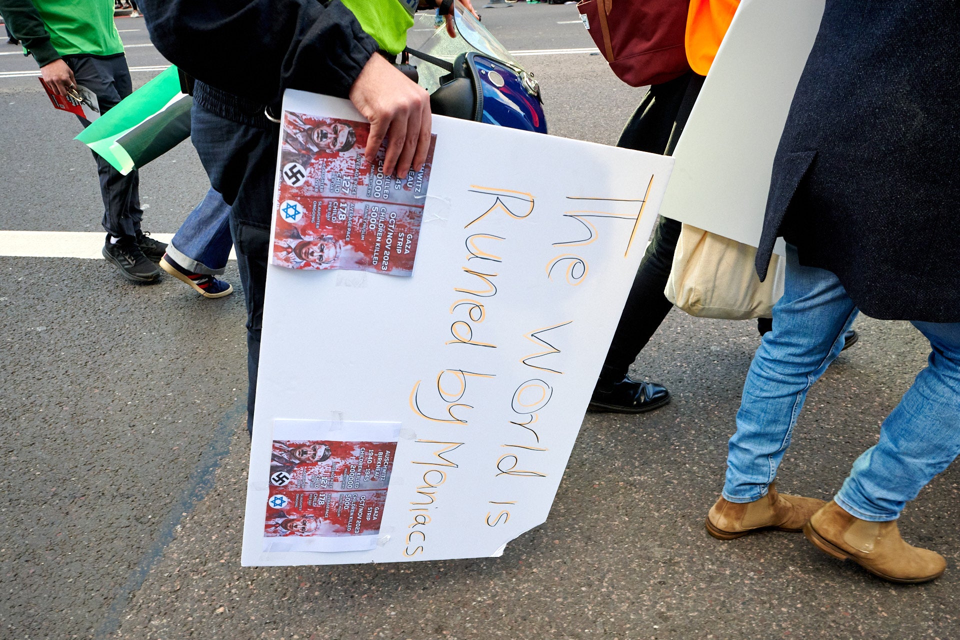 Police removing a banner showing a swastika