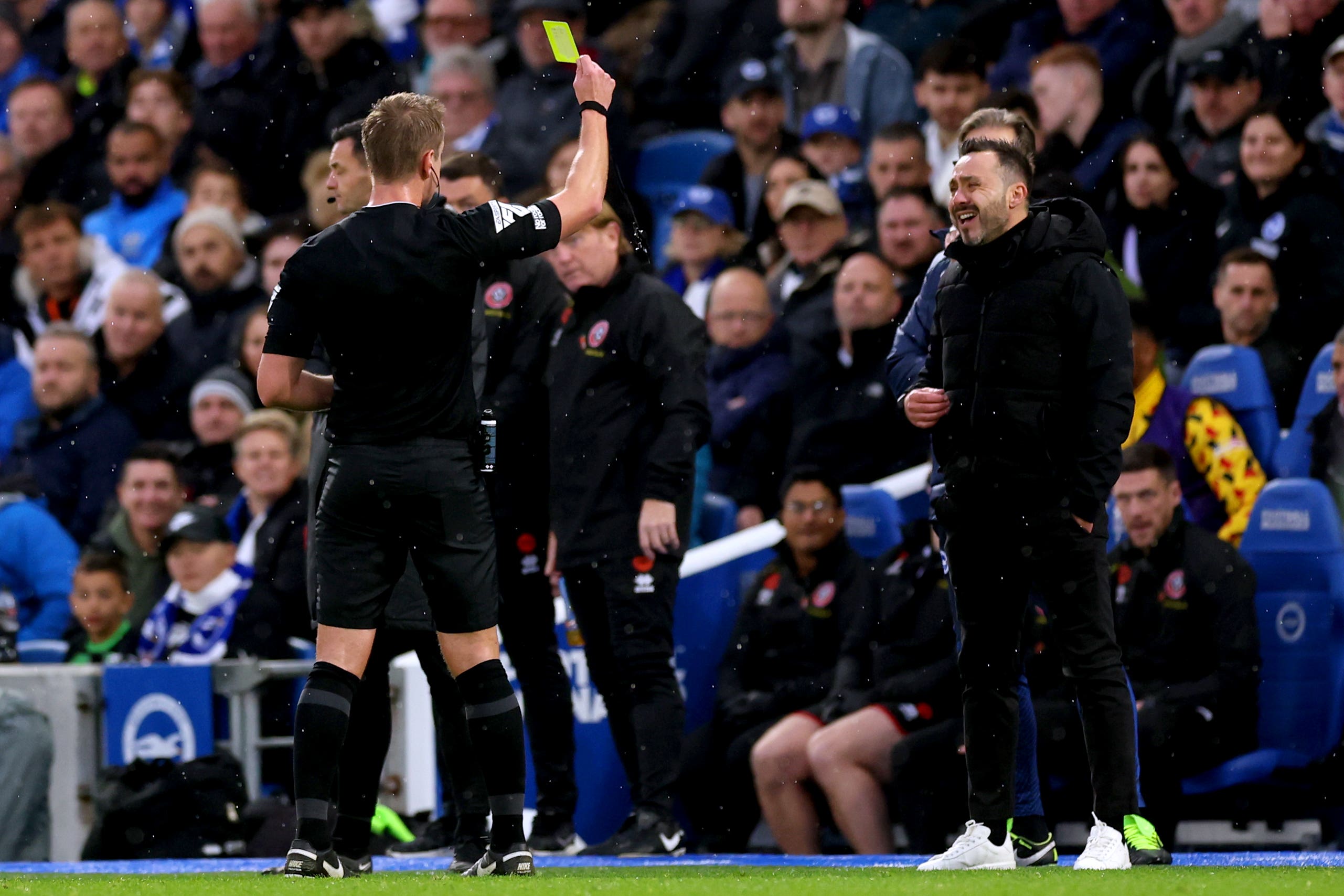 Brighton manager Roberto De Zerbi is shown a yellow card against Sheffield United (Steven Paston/PA)