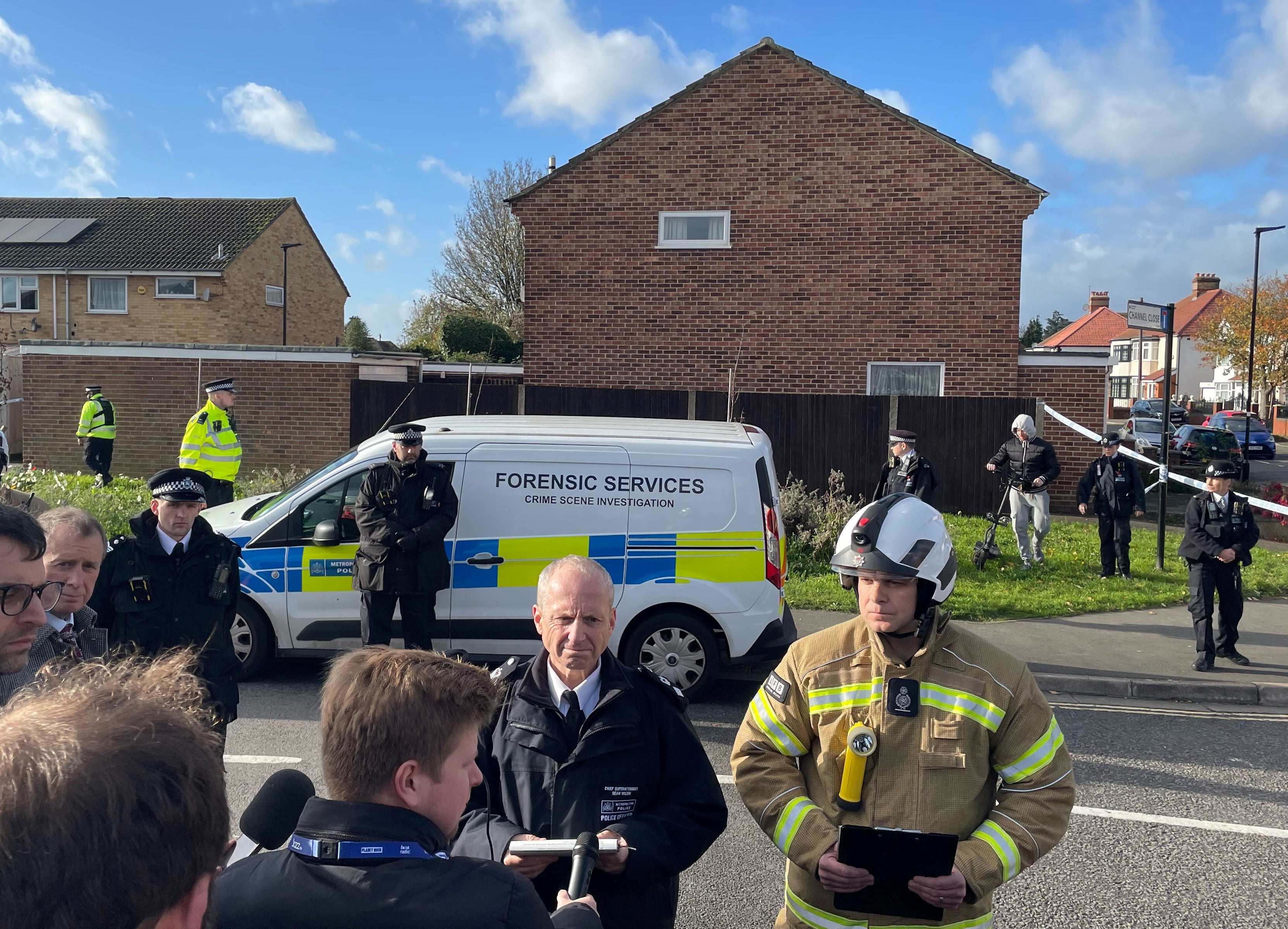 Metropolitan Police Chief Superintendent Sean Wilson with London Fire Brigade's Jonathan Smith speaking to the media at the scene