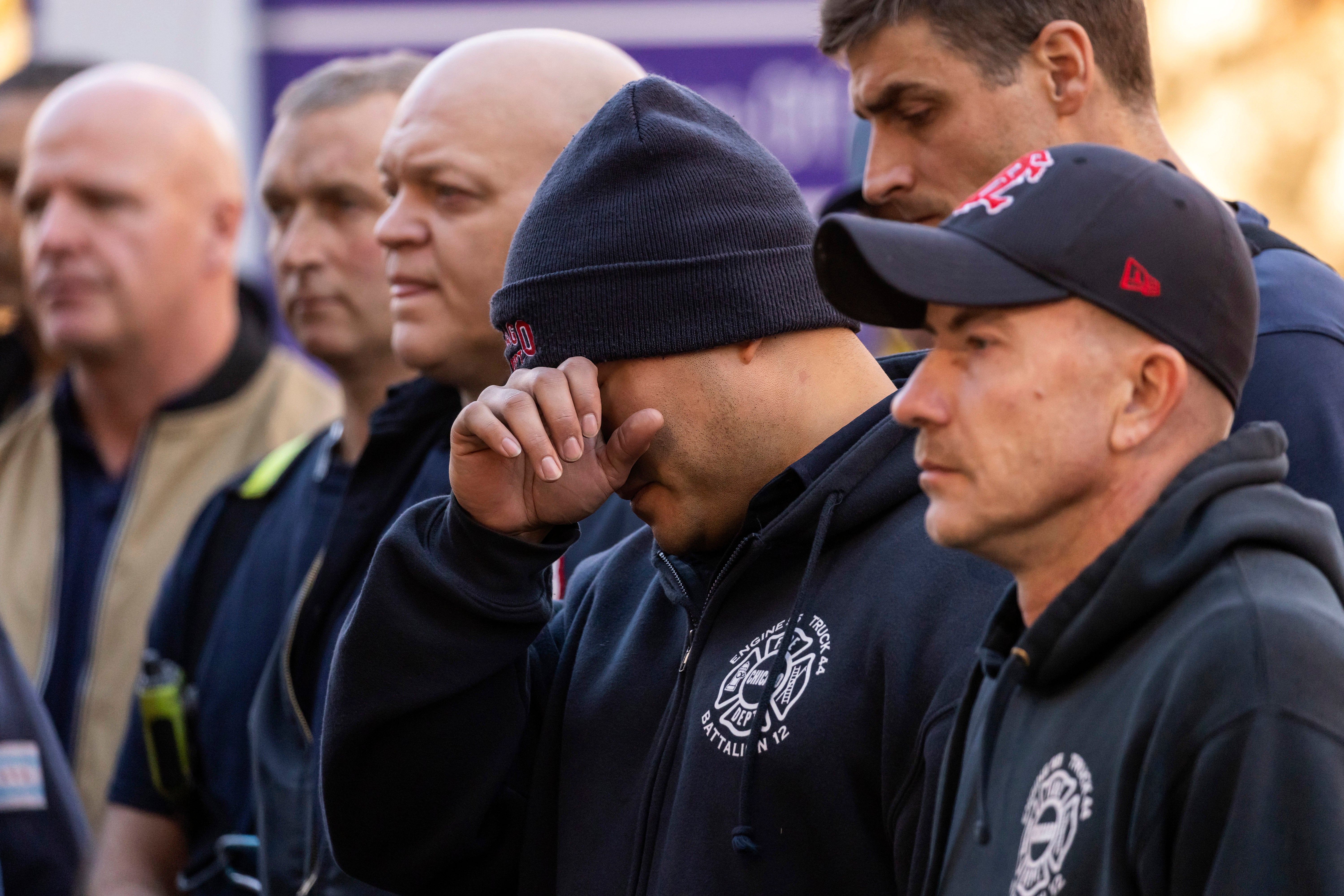 Chicago Fire Department personnel mourn outside Advocate Illinois Masonic Medical Center