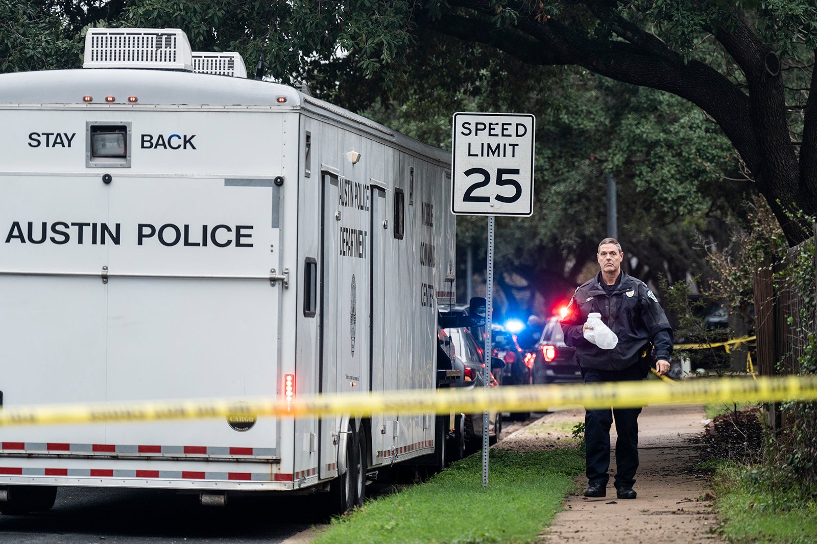 The Austin Police Department investigates the crime scene after an Austin police officer died following a shooting in South Austin, Texas on Saturday, Nov. 11, 2023.