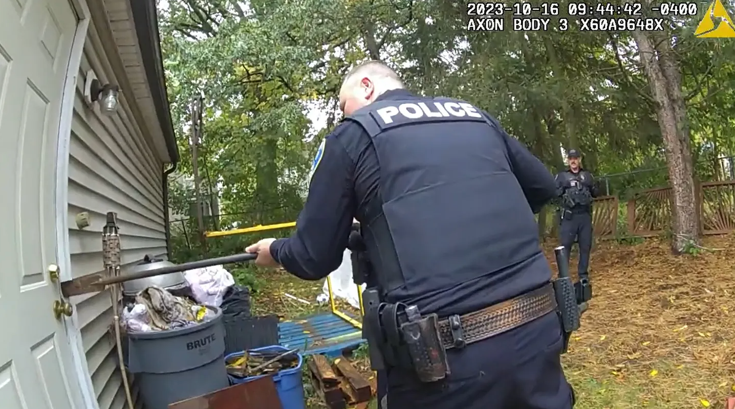 Police break through a door in Kenmore, Ohio