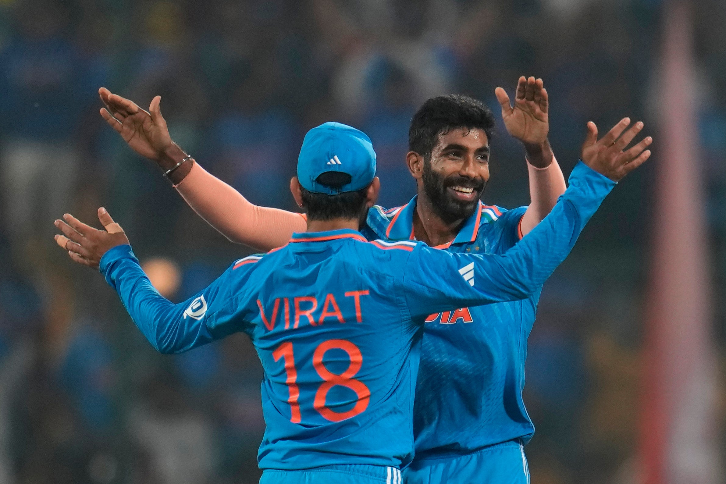 India's Jasprit Bumrah, right, and Virat Kohli celebrates the dismissal of Netherlands' Bas De Leede