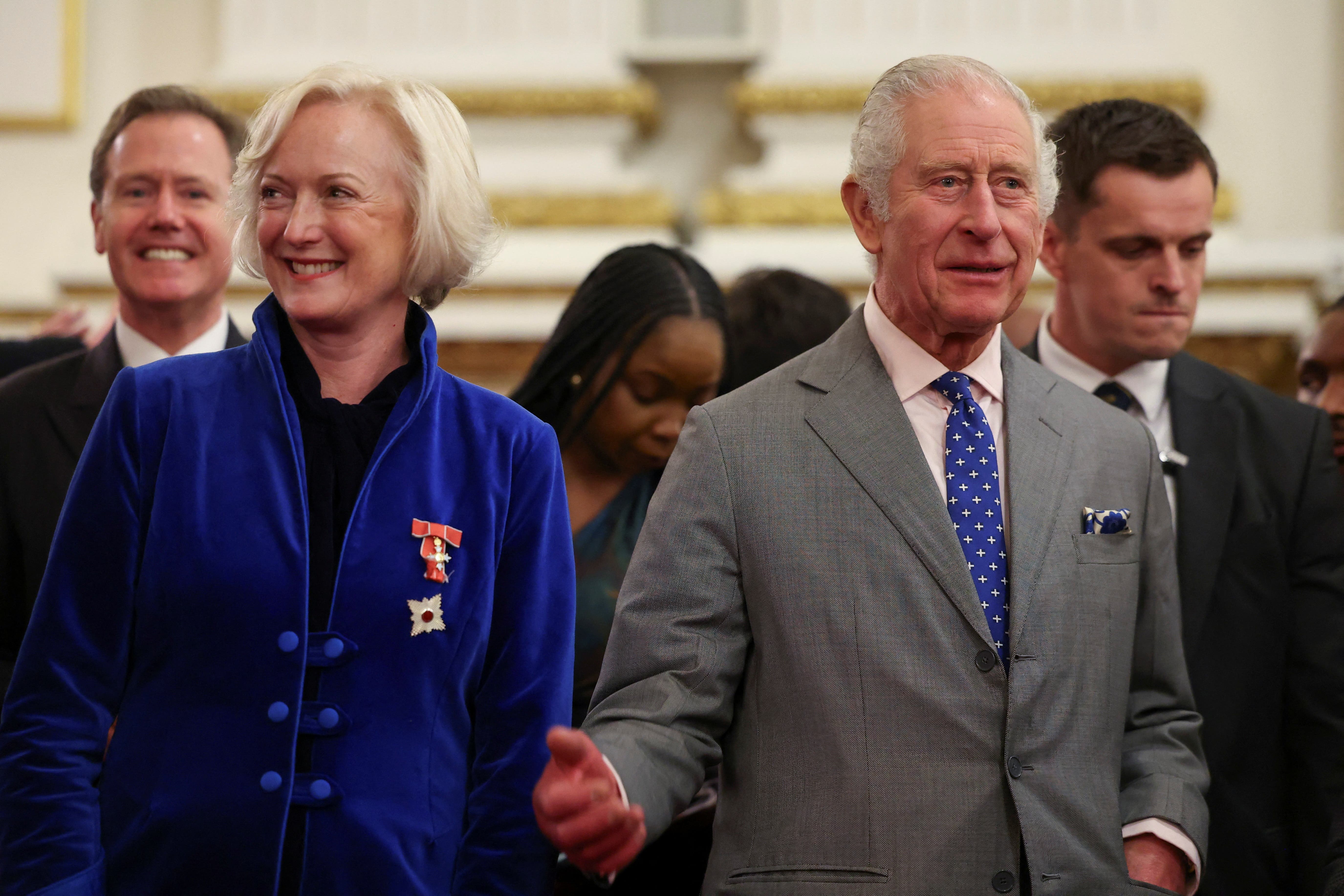 The King celebrated his 75th birthday by chatting to hundreds of NHS nurses at Buckingham Palace (Toby Melville/PA)