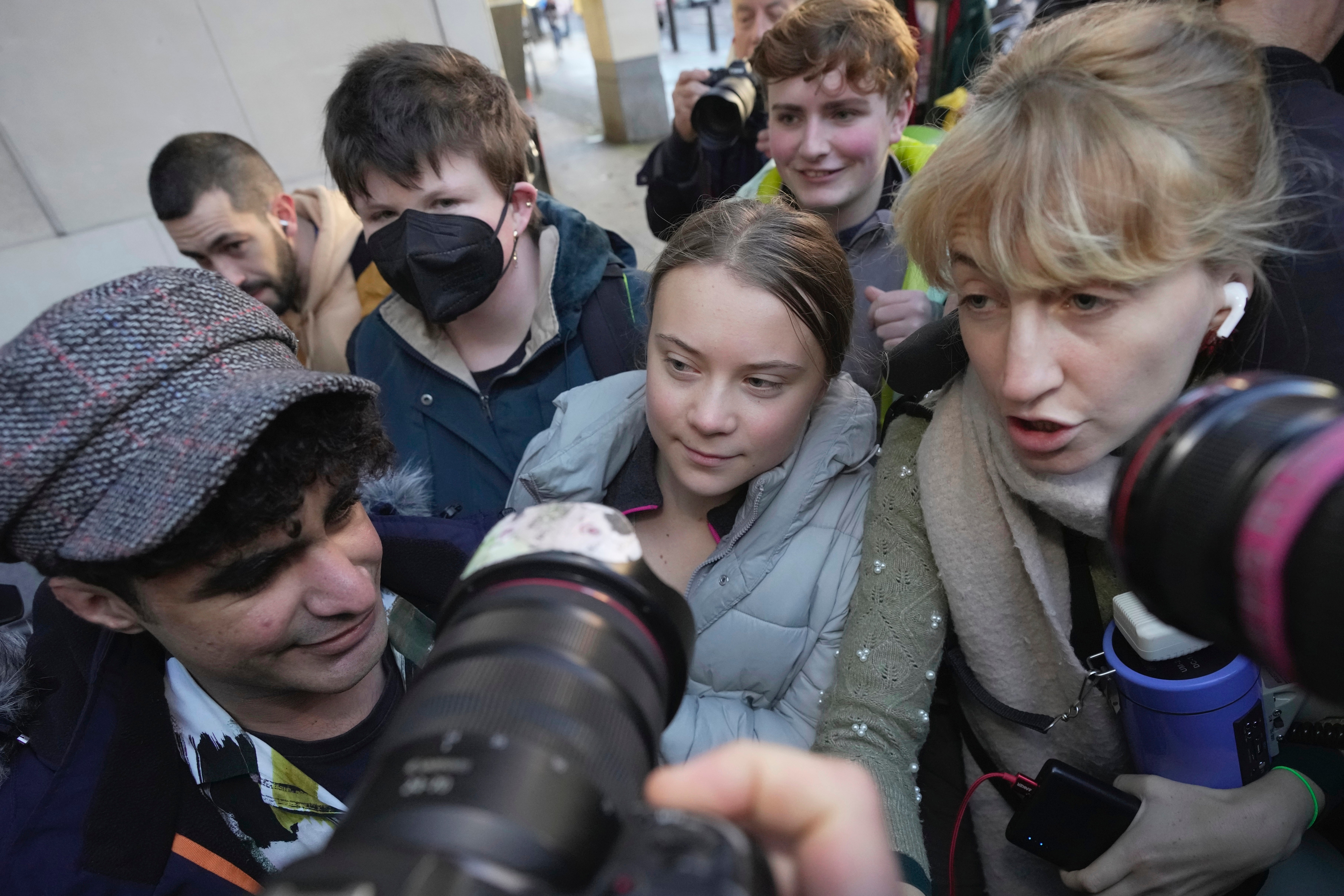 Greta Thunberg arrives at court to throng of photographers