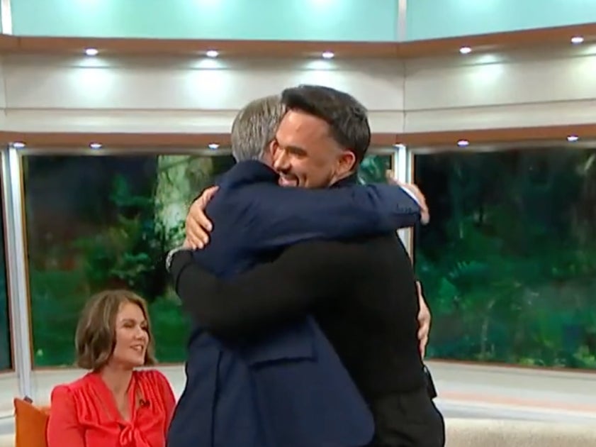 Ed Balls and Gareth Gates hug after discussing their stammers