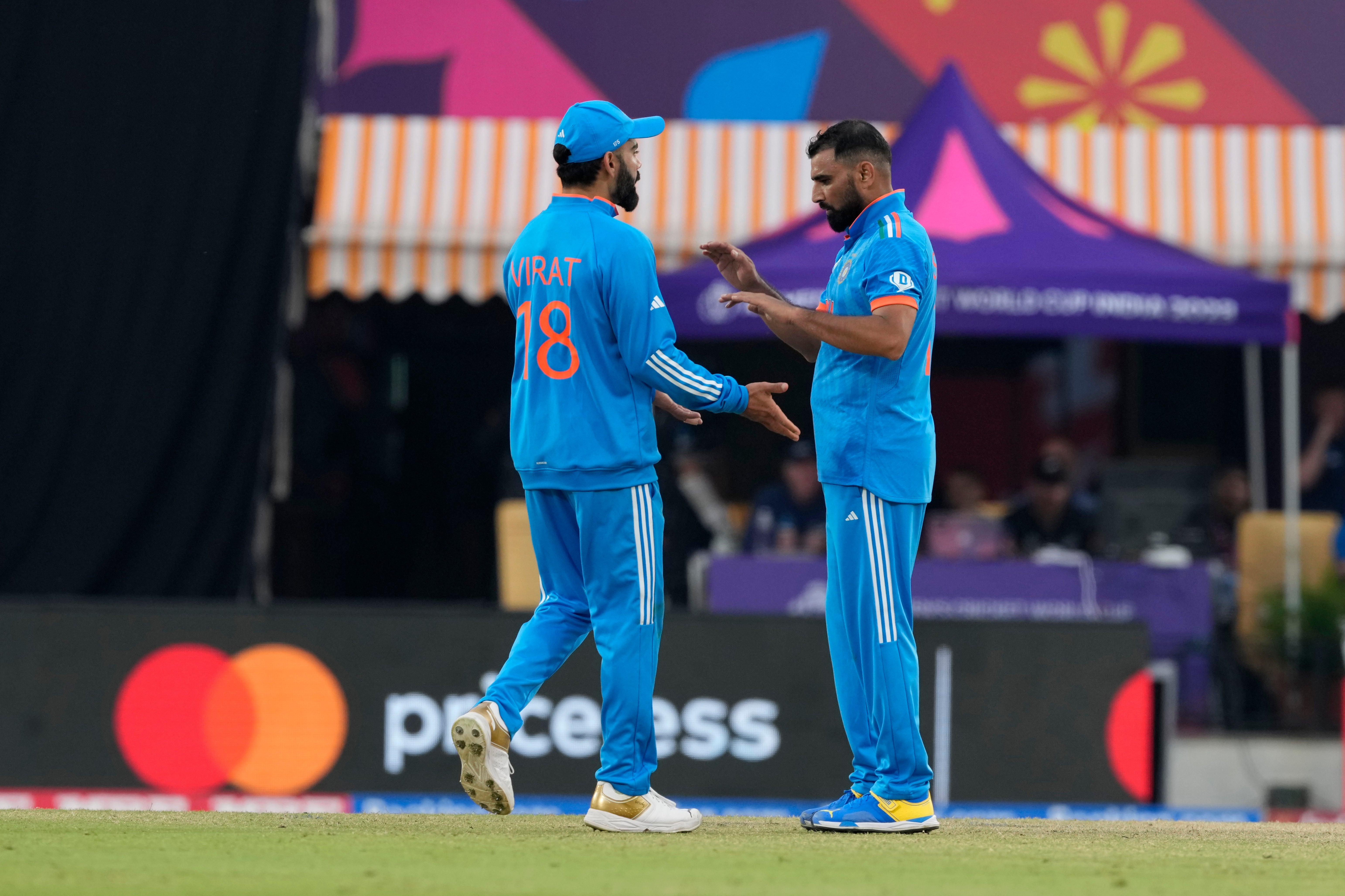 Virat Kohli, left, and Mohammed Shami led India to victory