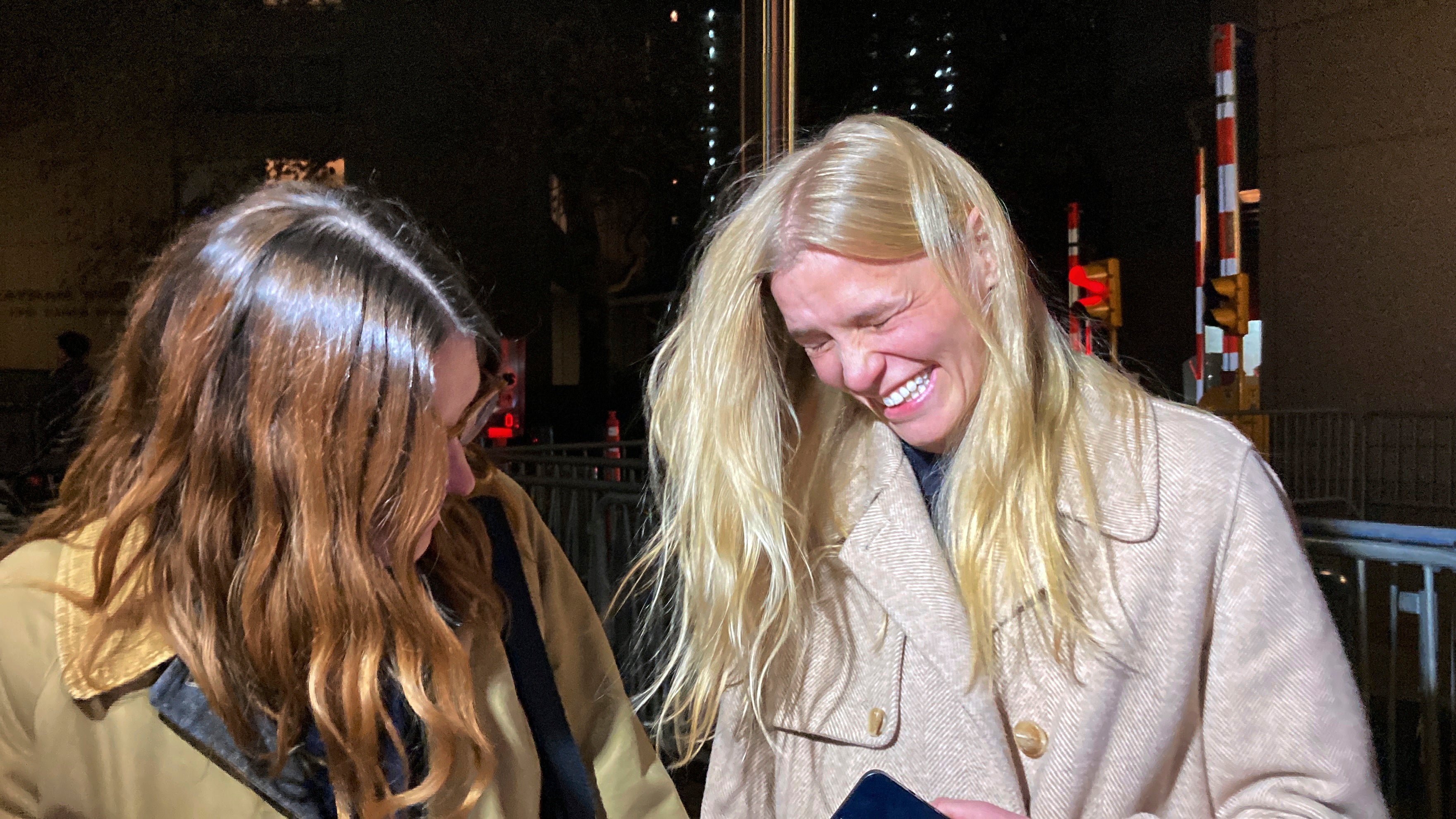 Graham Chase Robinson, right, smiles outside Manhattan federal court next to her attorney Alexandra Harwin after a jury awarded her $1.2m for gender discrimination and retaliation