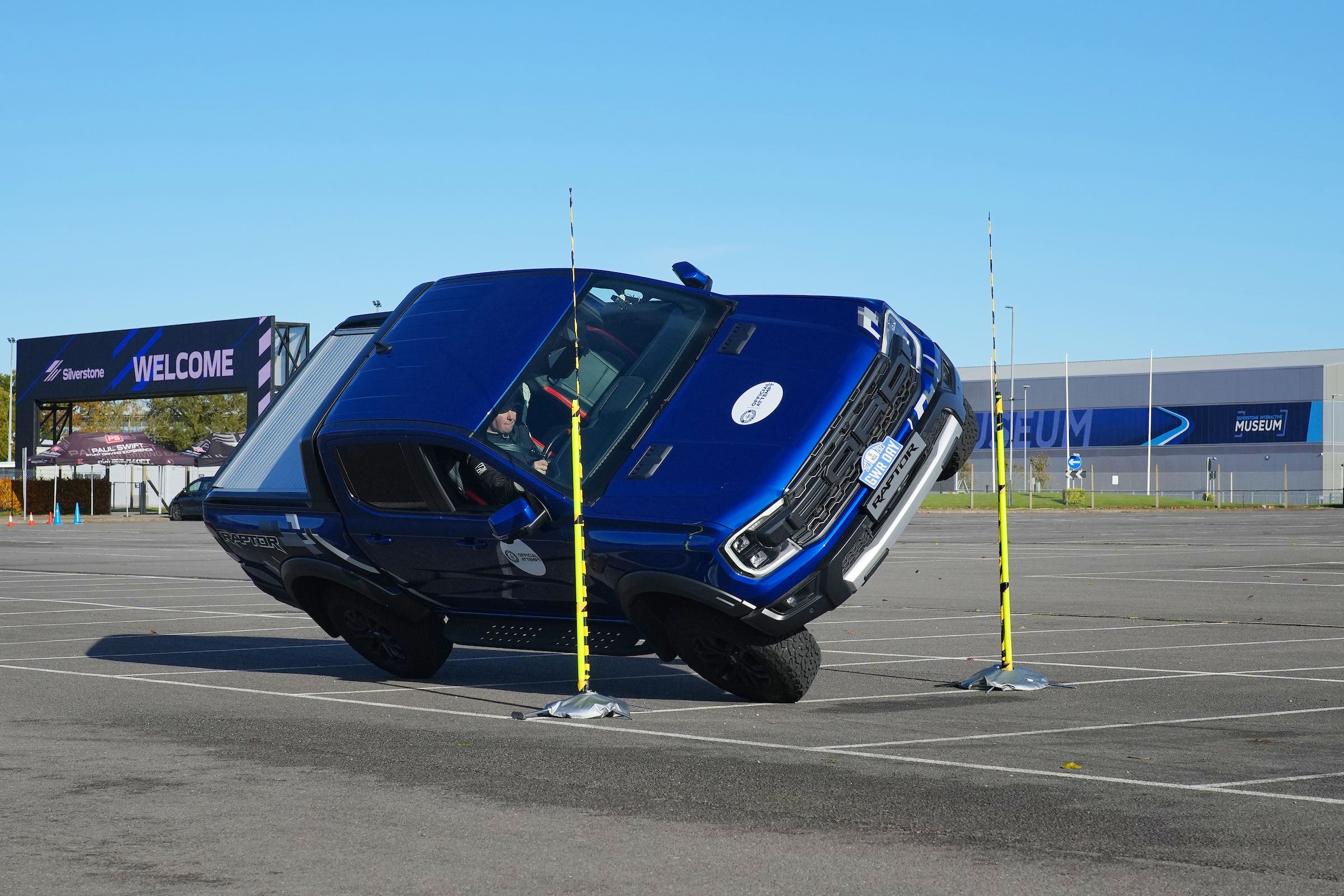 Paul Swift achieves the Guinness World Record for ‘The tightest gap driven through on two wheels in a pickup truck (88cm)’ in celebration of Guinness World Records Day 2023 (Guinness World Records Day 2023)