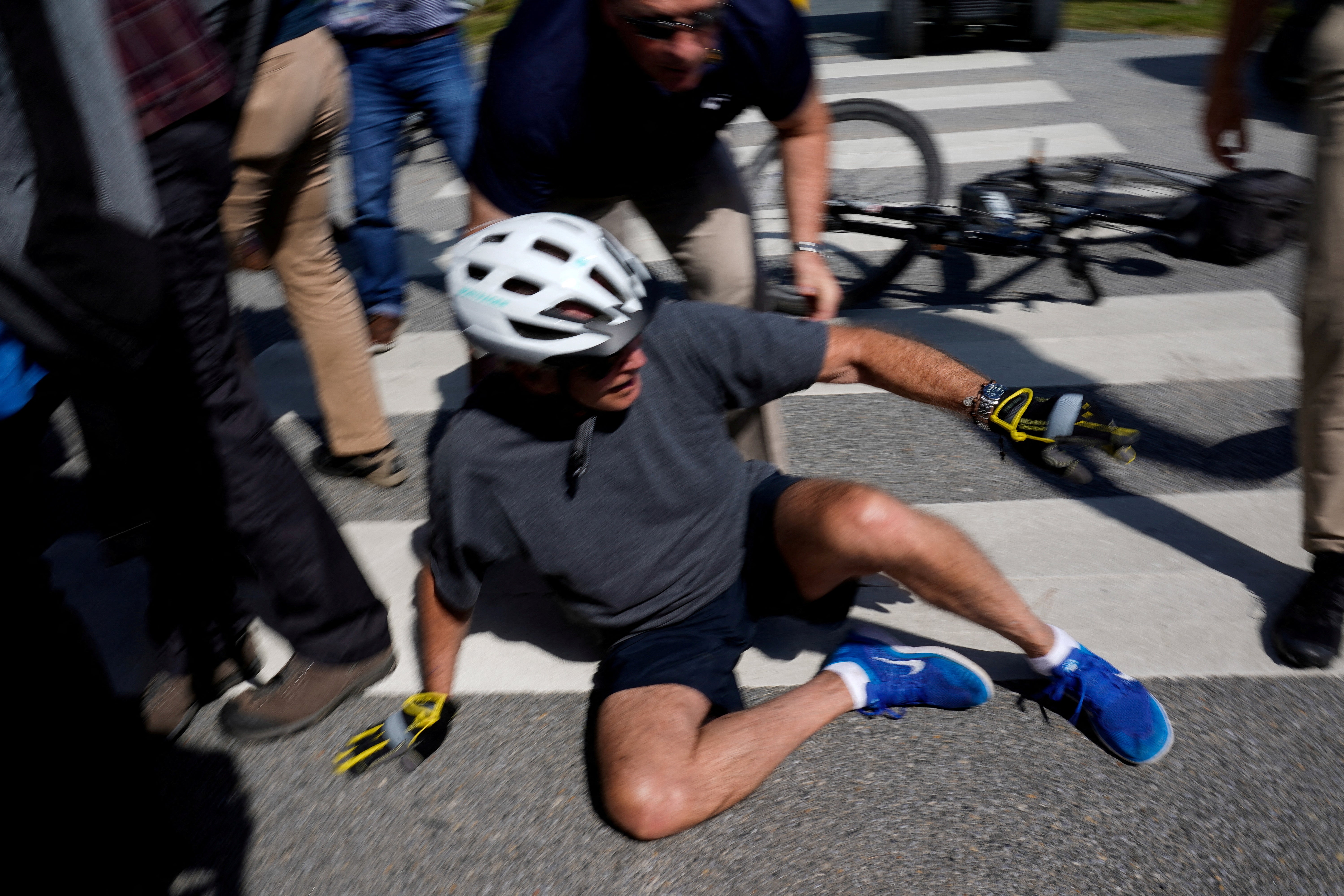 Joe Biden takes a spill while riding his bike in Rehoboth Beach, Delaware