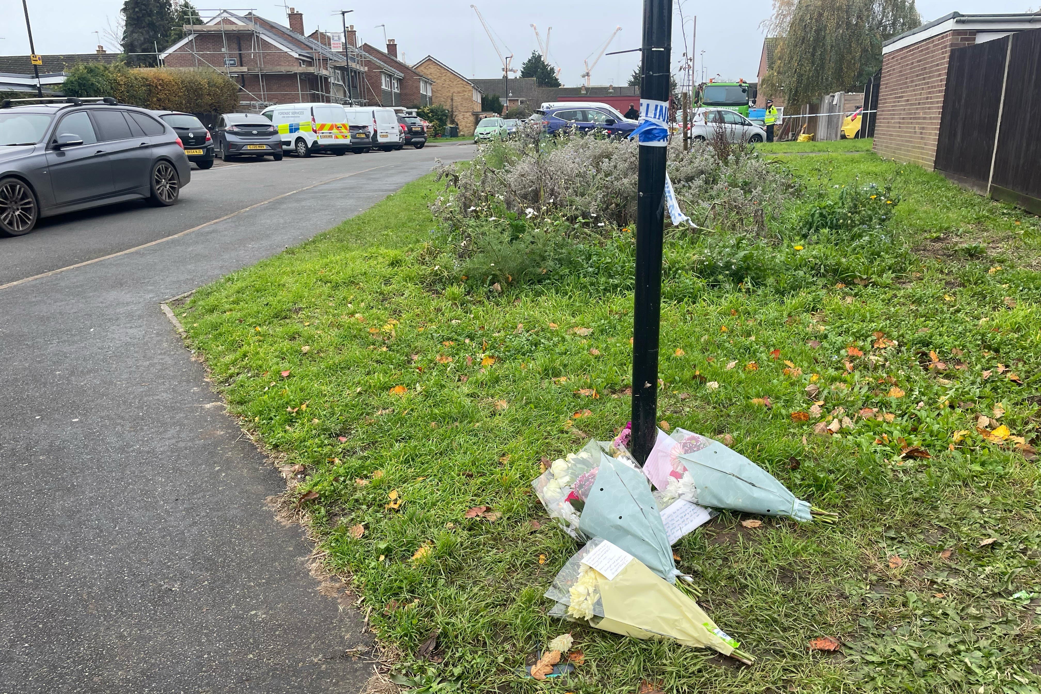 Flowers and tributes were left at the scene of the house fire in Hounslow (George Lithgow/PA)