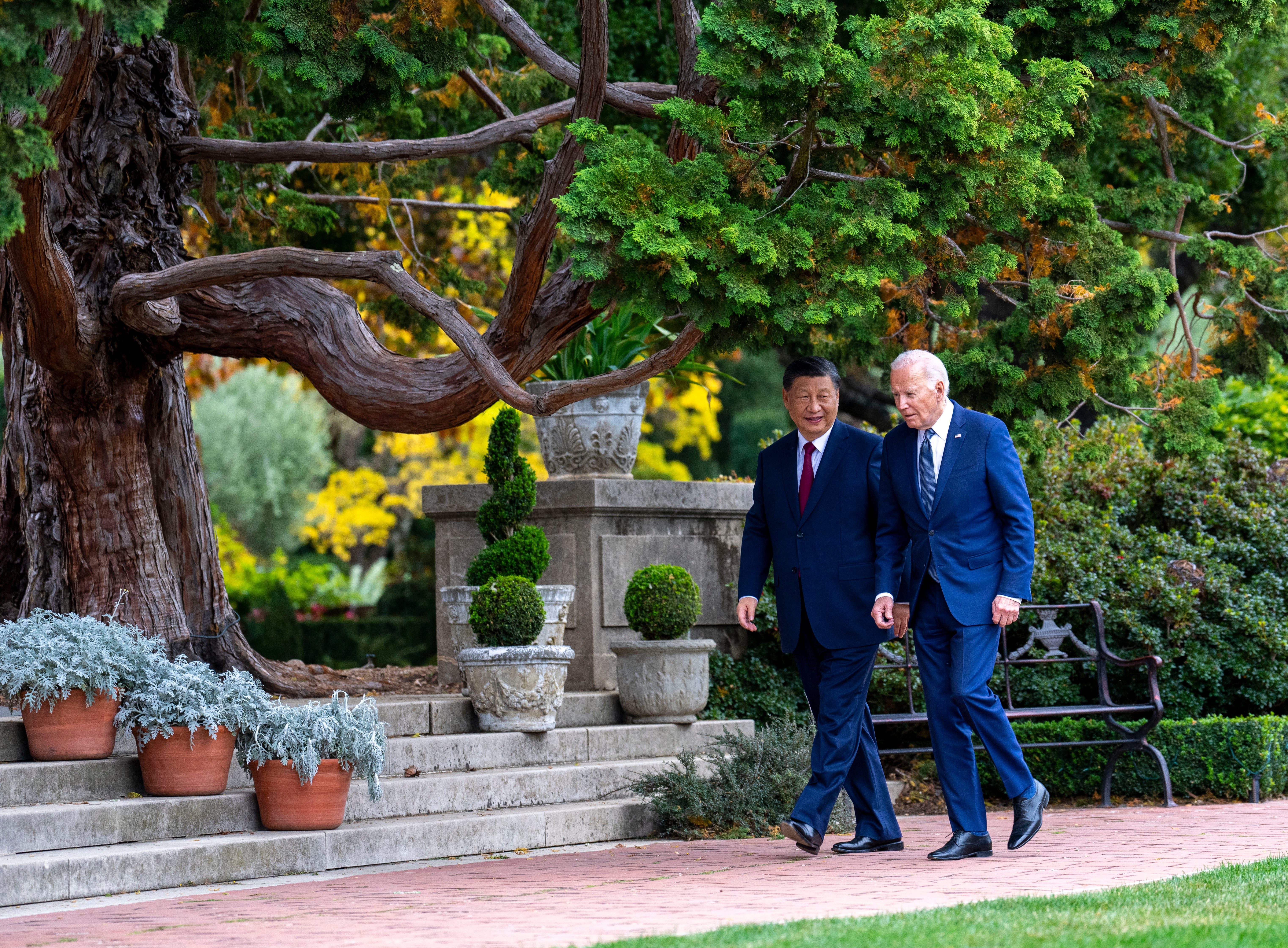 Joe Biden and Xi Jinping walk in the gardens at the Filoli Estate in Woodside, California