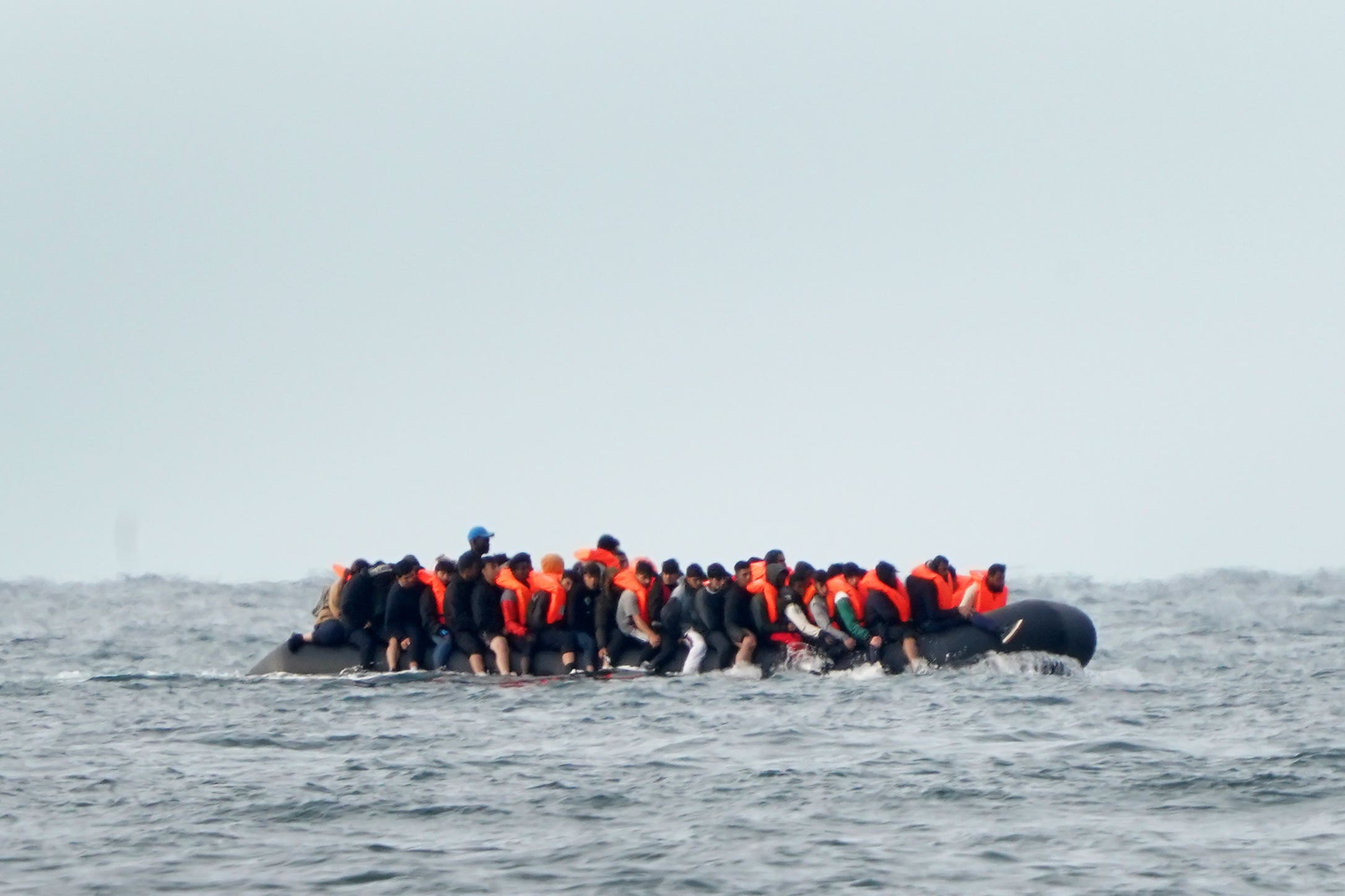 A group of people thought to be migrants crossing the Channel in a small boat in August (PA)