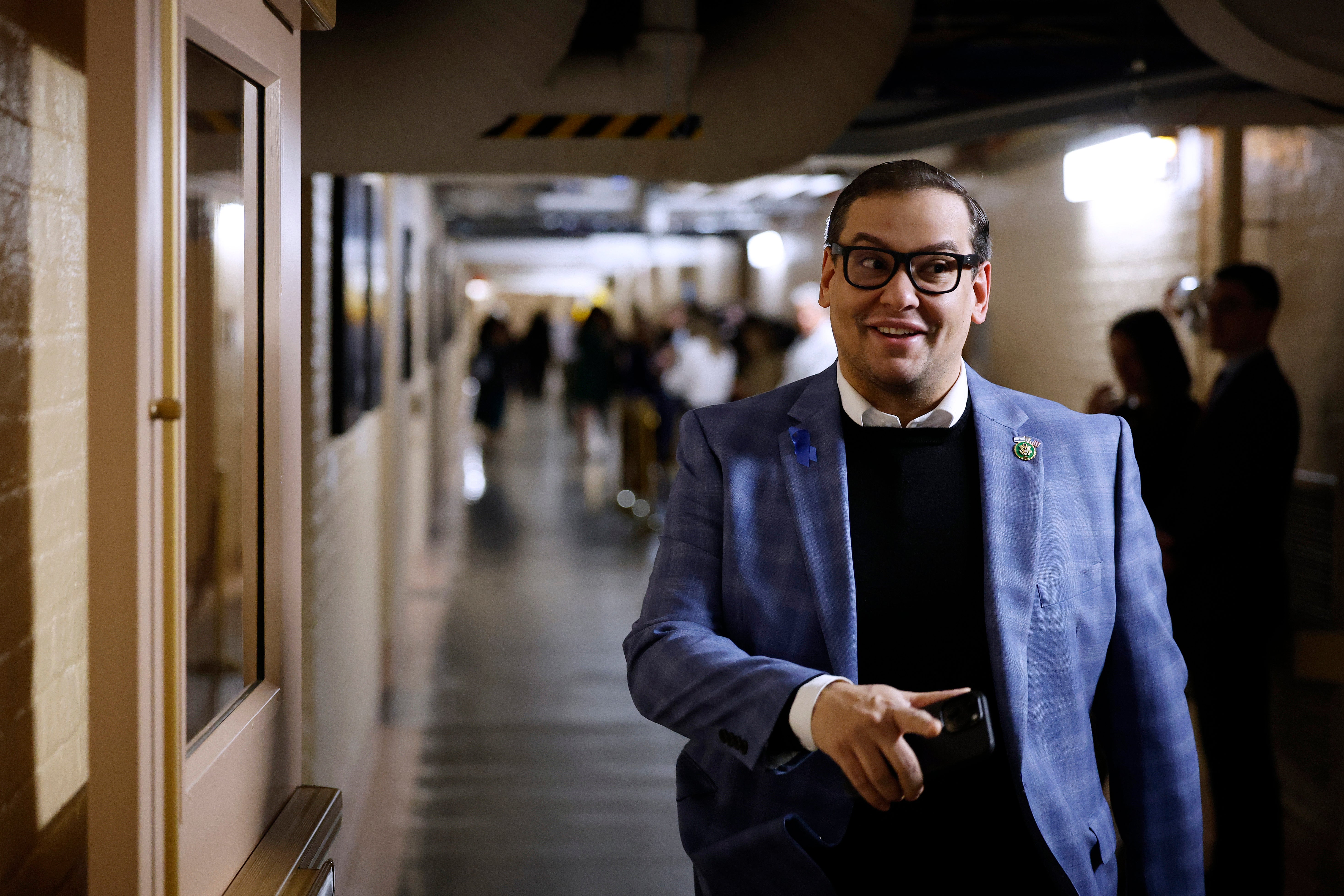 Botox-loving George Santos walks the halls of Congress