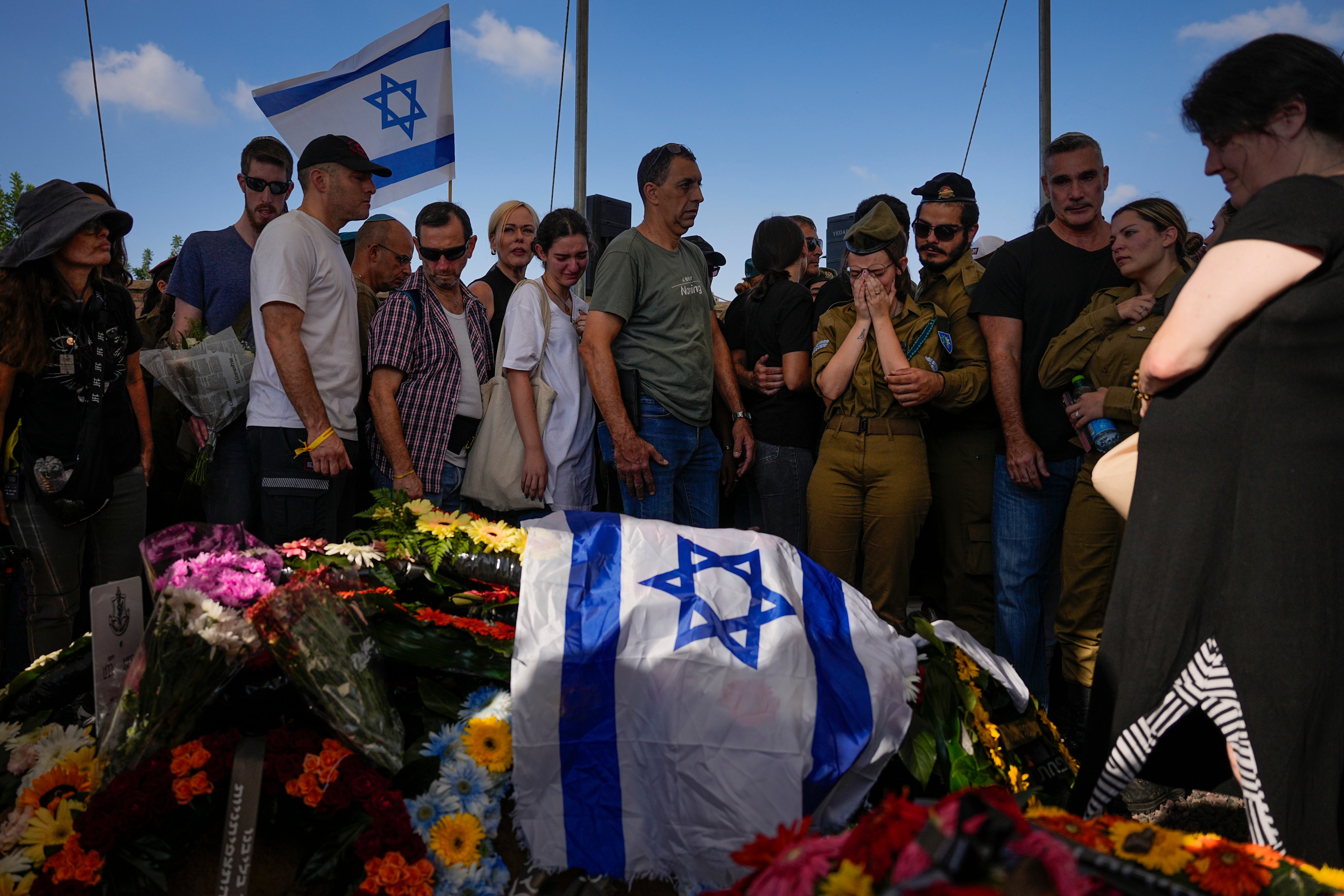 Mourners attend the funeral of Israeli soldier, Noa Marciano, in Modiin, Israel, Friday, 17 Nov 2023. The Israeli military said Marciano's body was found in a building near Shifa Hospital in the Gaza Strip and brought to Israel for identification by the military rabbinate. Marciano is one of three hostages declared dead since 7 October.