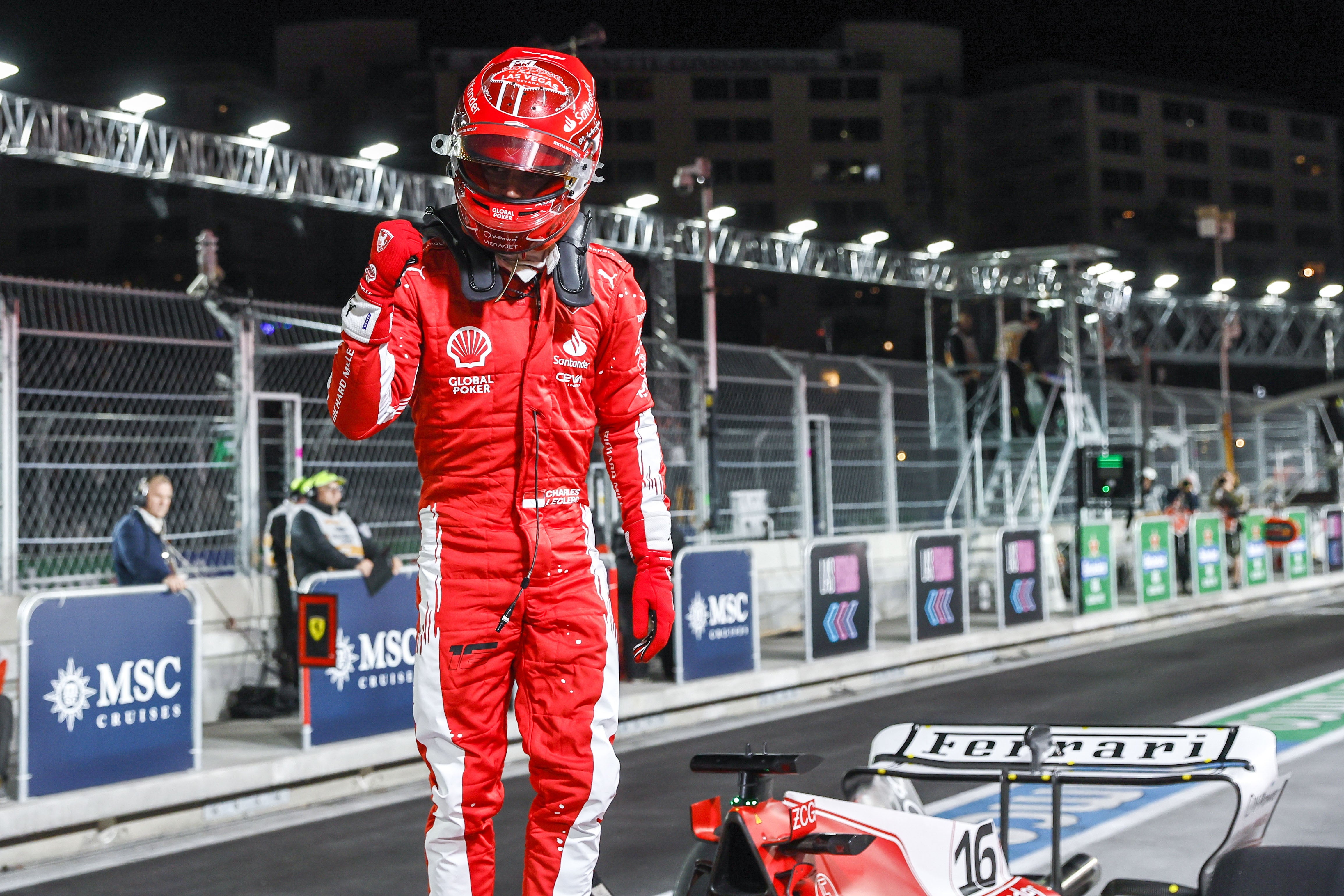 Charles Leclerc celebrates after winning pole in Las Vegas