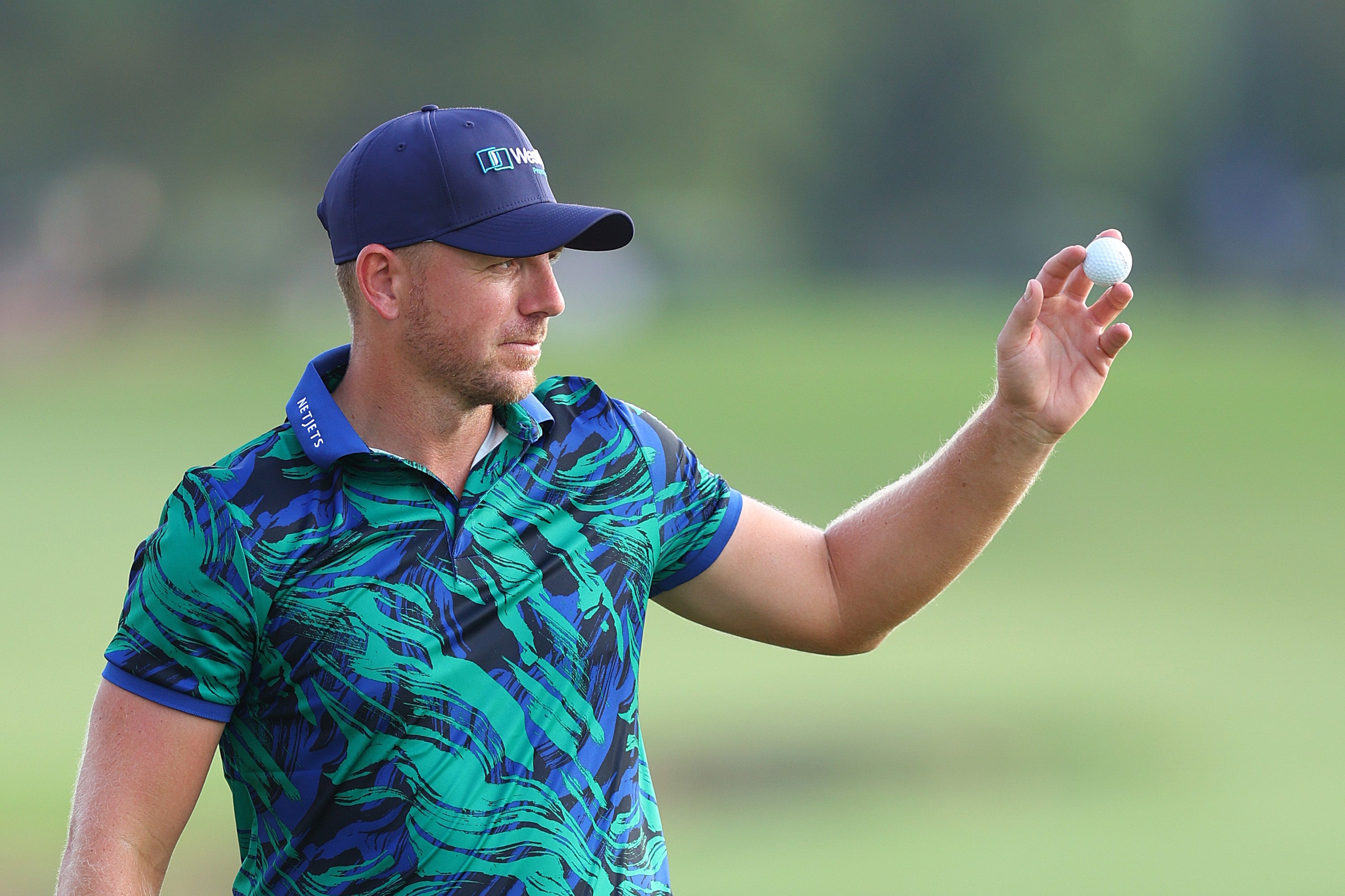 Matt Wallace salutes the crowd on the 18th green