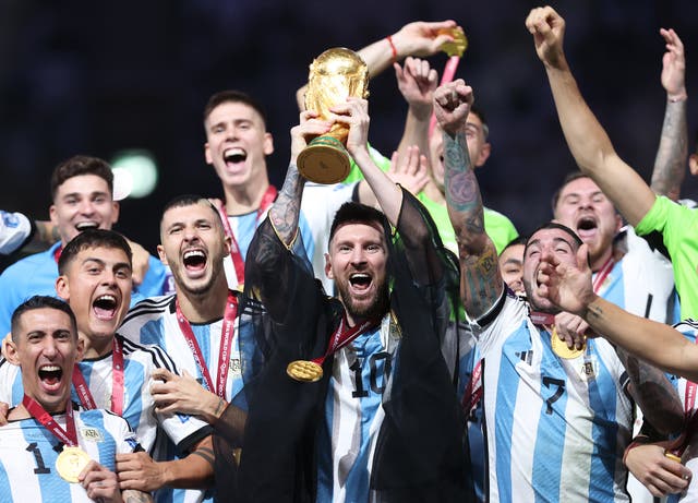 <p>Lionel Messi lifts the Fifa World Cup trophy after Argentina’s penalty shootout win over France at Lusail Stadium on 18 December 2022 in Lusail City, Qatar</p>