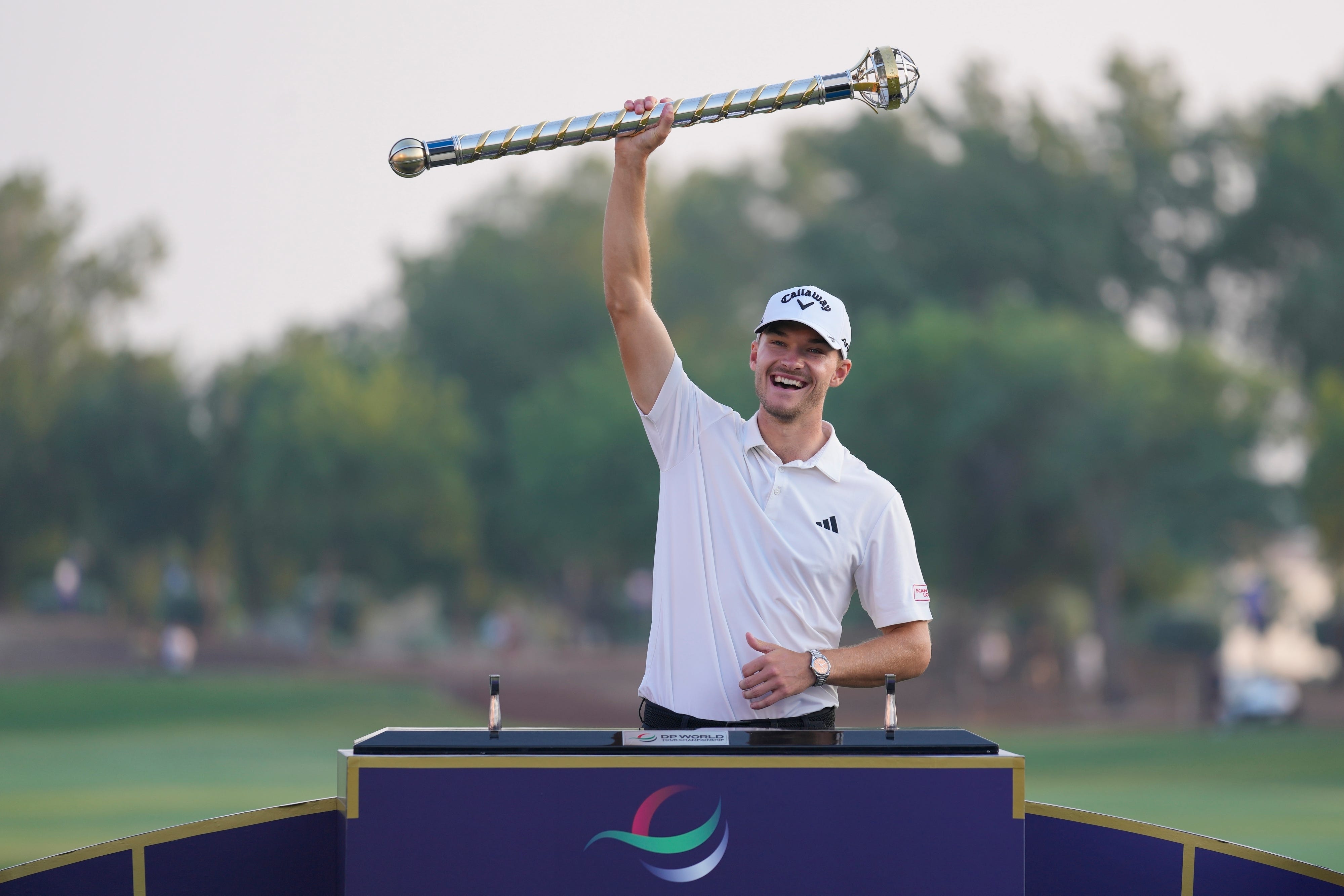 Nicolai Hojgaard of Denmark poses with his trophy after winning the DP World Tour Championship in Dubai (Kamran Jebreili/AP)