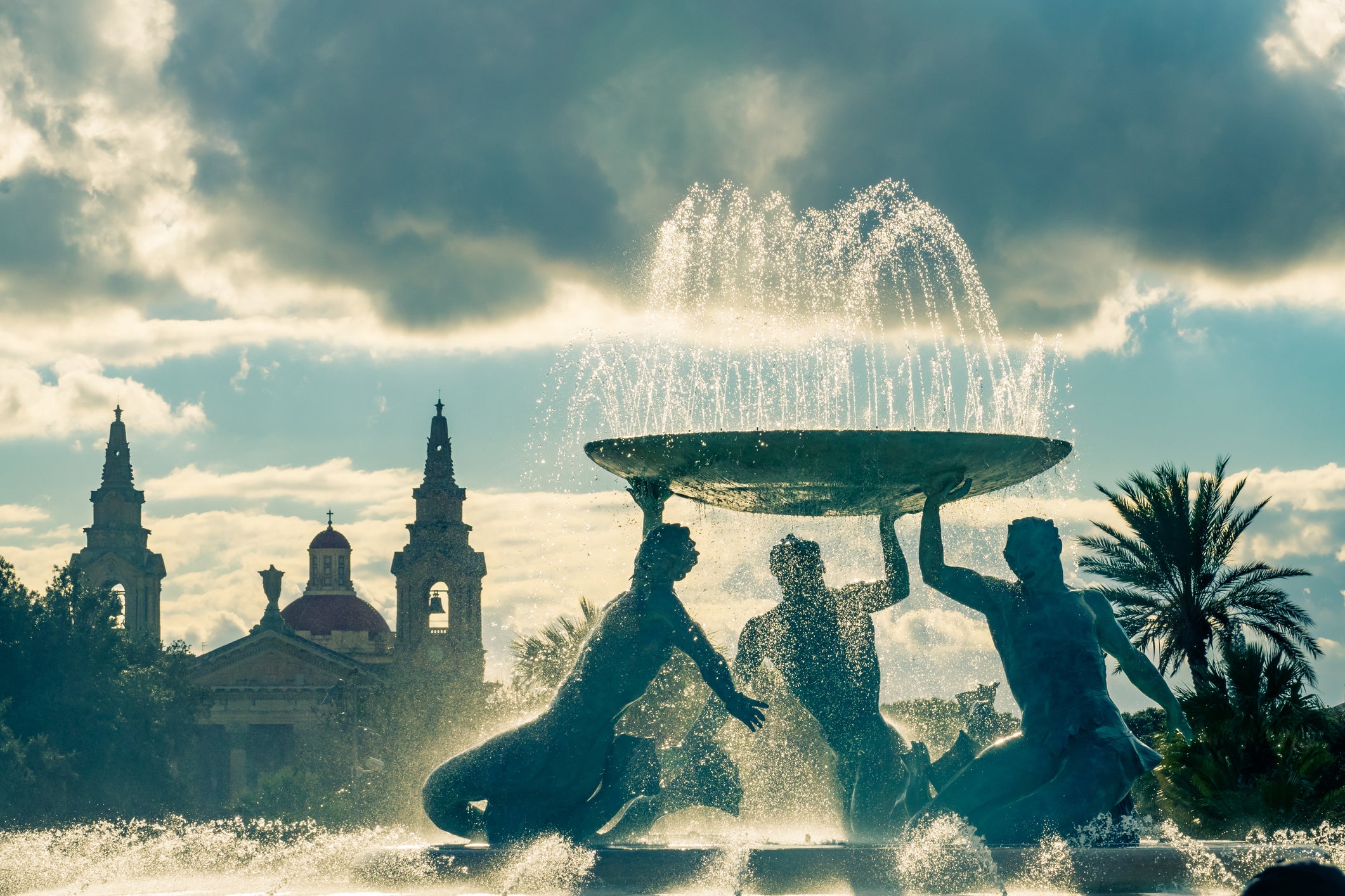 At the entrance of Valletta’s gates, the fountain’s three bronze Tritons balance a basin of water