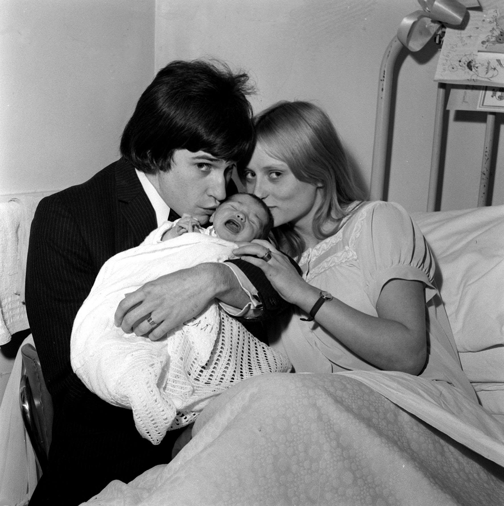 Davies pictured with then wife Rasa and baby daughter Louise Claire Rasa, in June 1965