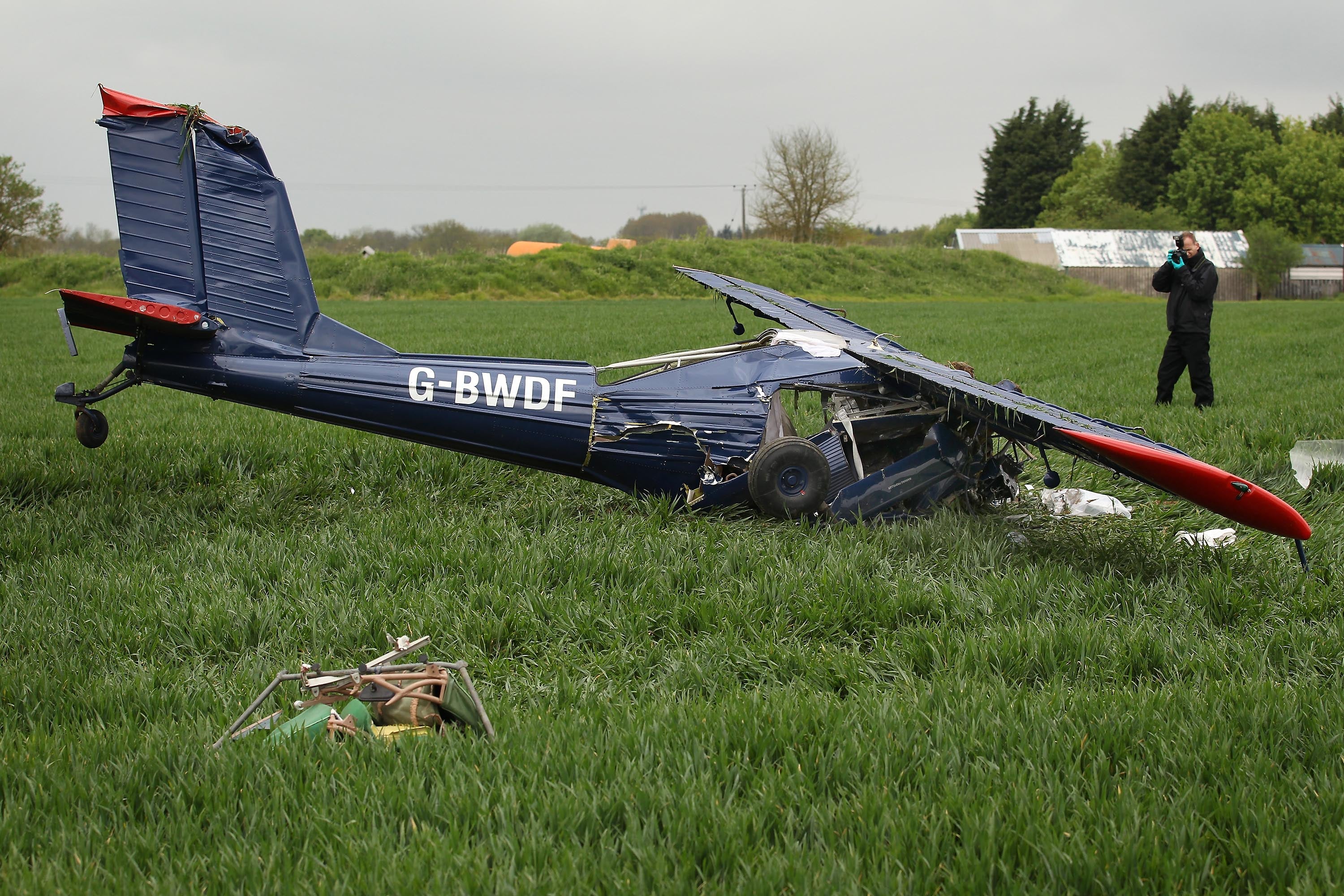 A light aircraft lies in a field at Hinton Airfield after crashing on May 6, 2010 in Brackley, England