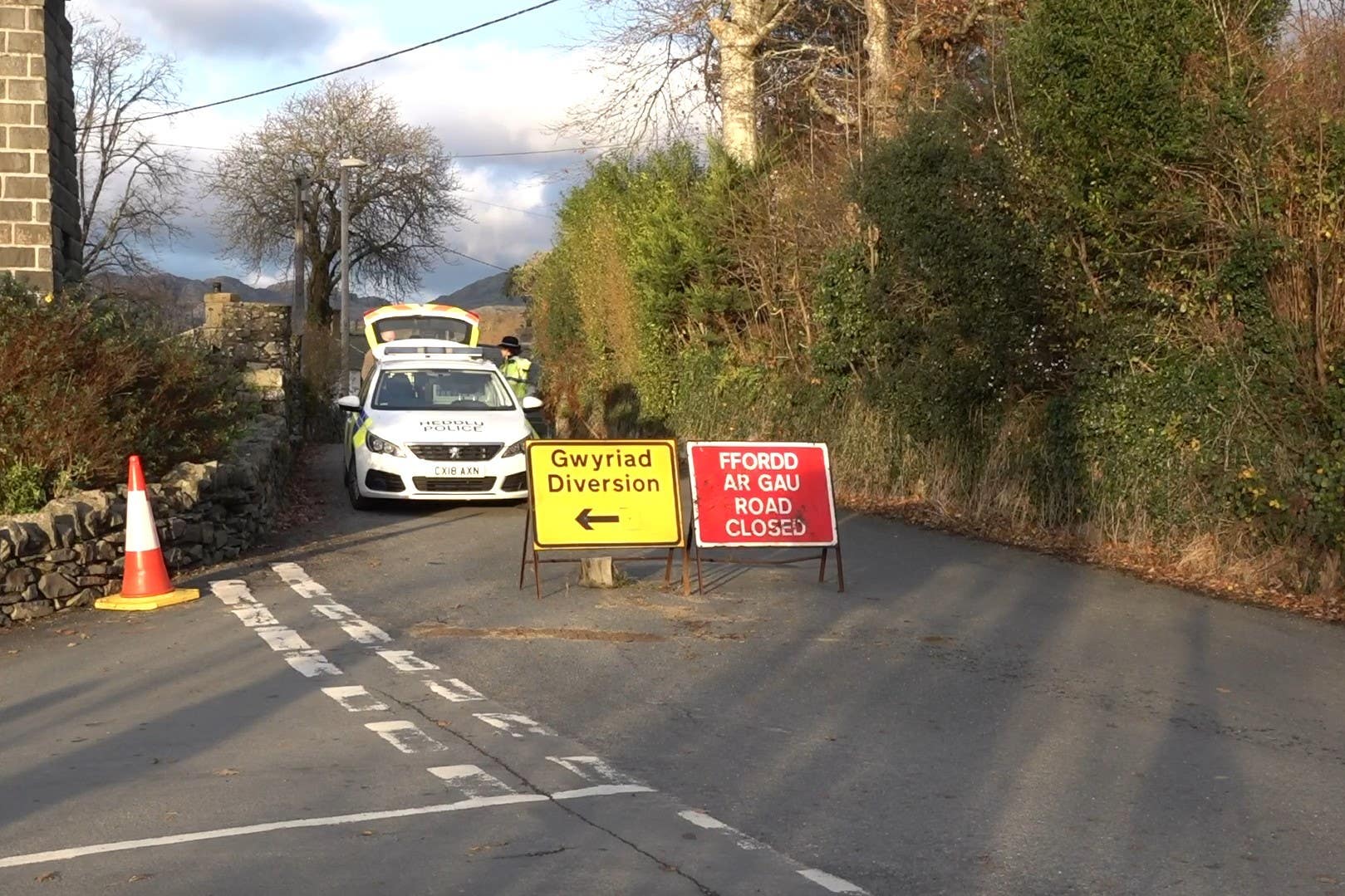 The bodies were found inside an overturned car at Garreg, North Wales (PA)