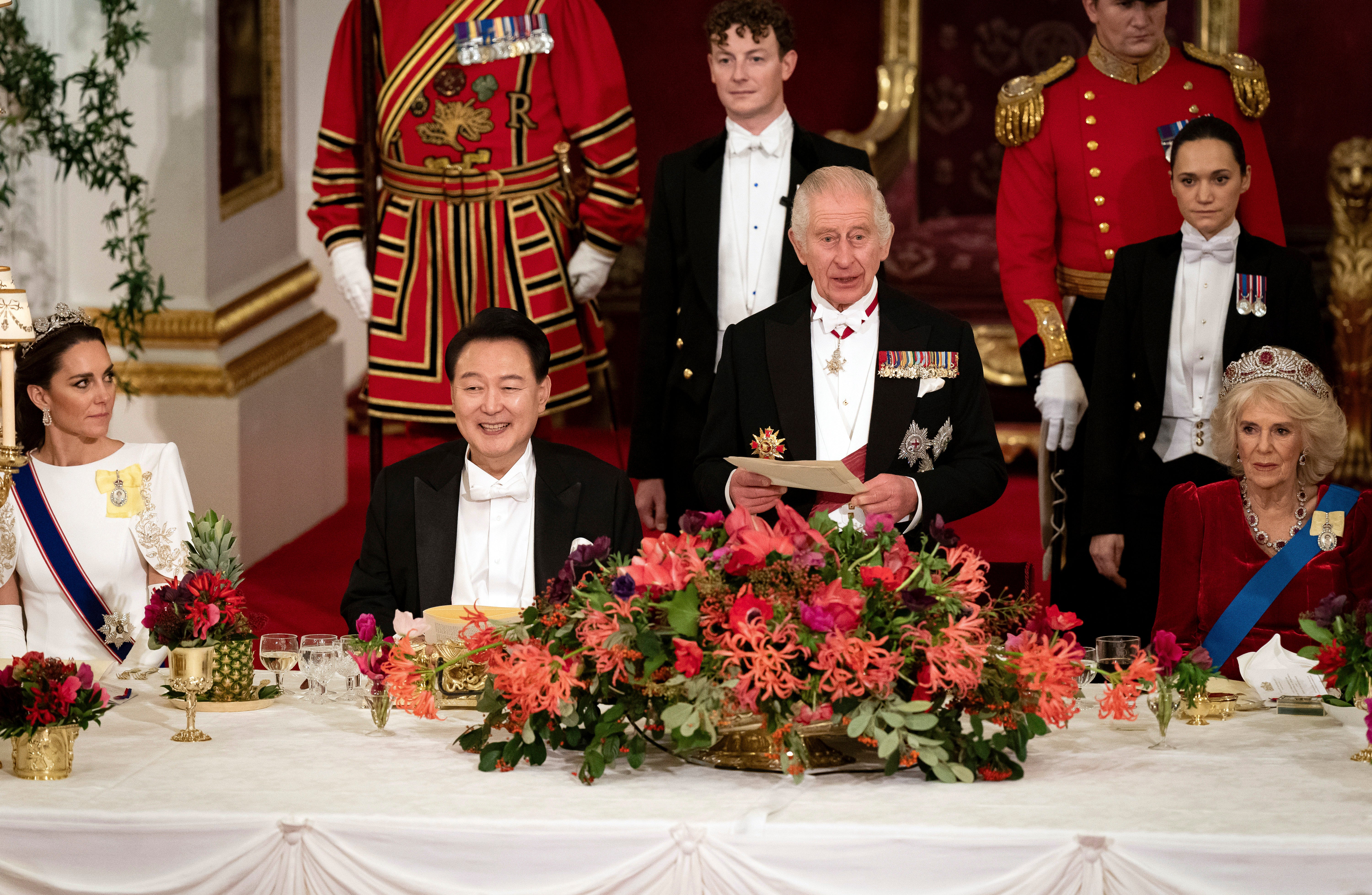 President of South Korea Yoon Suk Yeol listens to King Charles III at the state banquet at Buckingham Palace