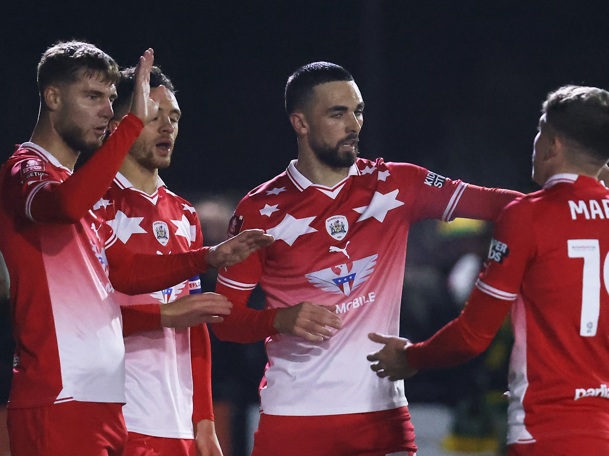 John McAtee of Barnsley celebrates with teammates against Horsham