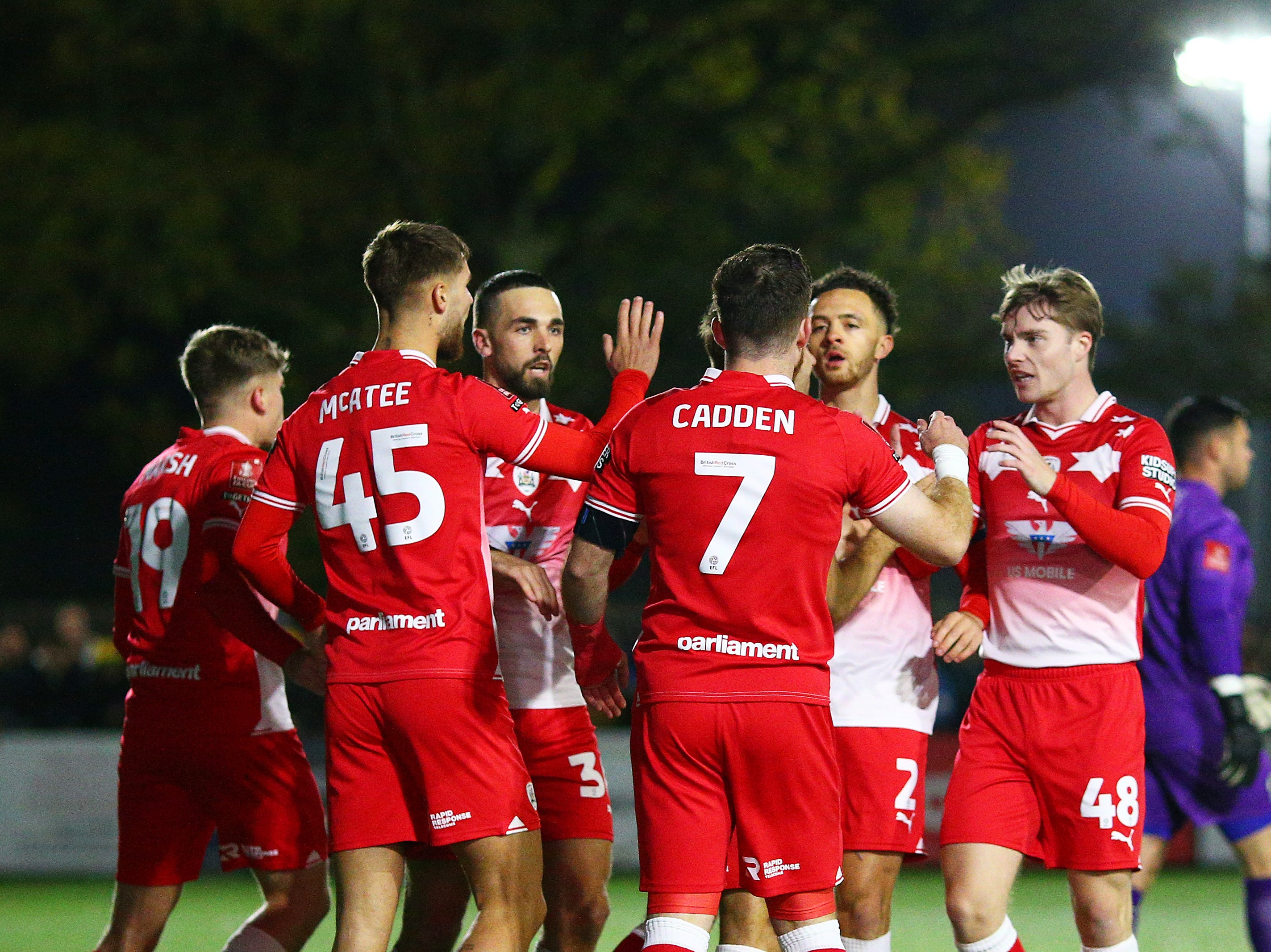 Nicky Cadden of Barnsley celebrates with teammates after scoring against Horsham