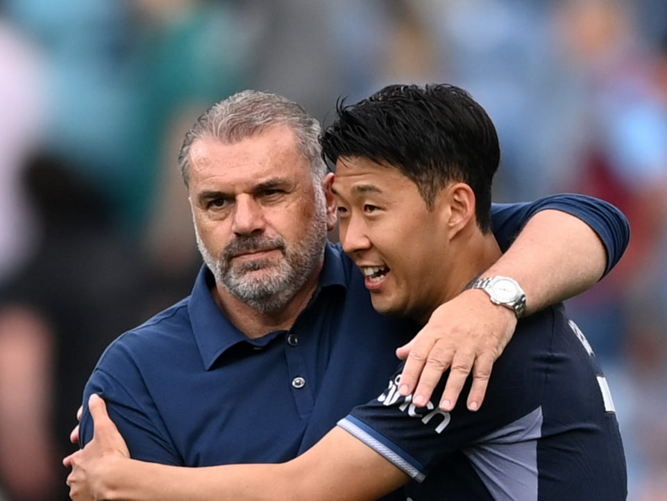 Heung-Min Son of Tottenham Hotspur celebrates with Ange Postecoglou against Burnley