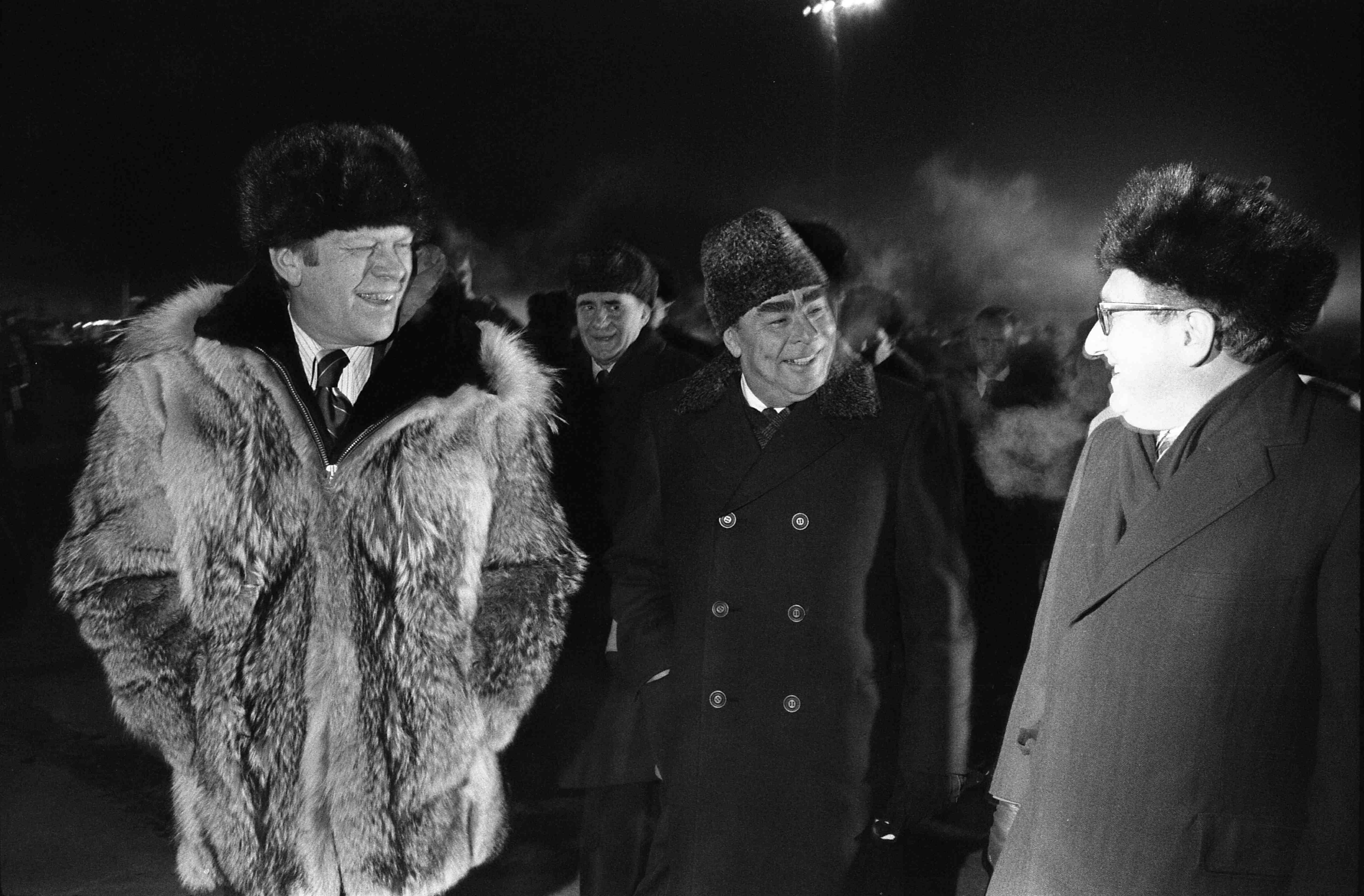 US president Gerald Ford, Soviet general secretary Lenoid Brezhnev and Kissinger speaking informally at the conclusion of the Vladivostok Summit on the tarmac at Vozdvizhenka Airport in November 1974