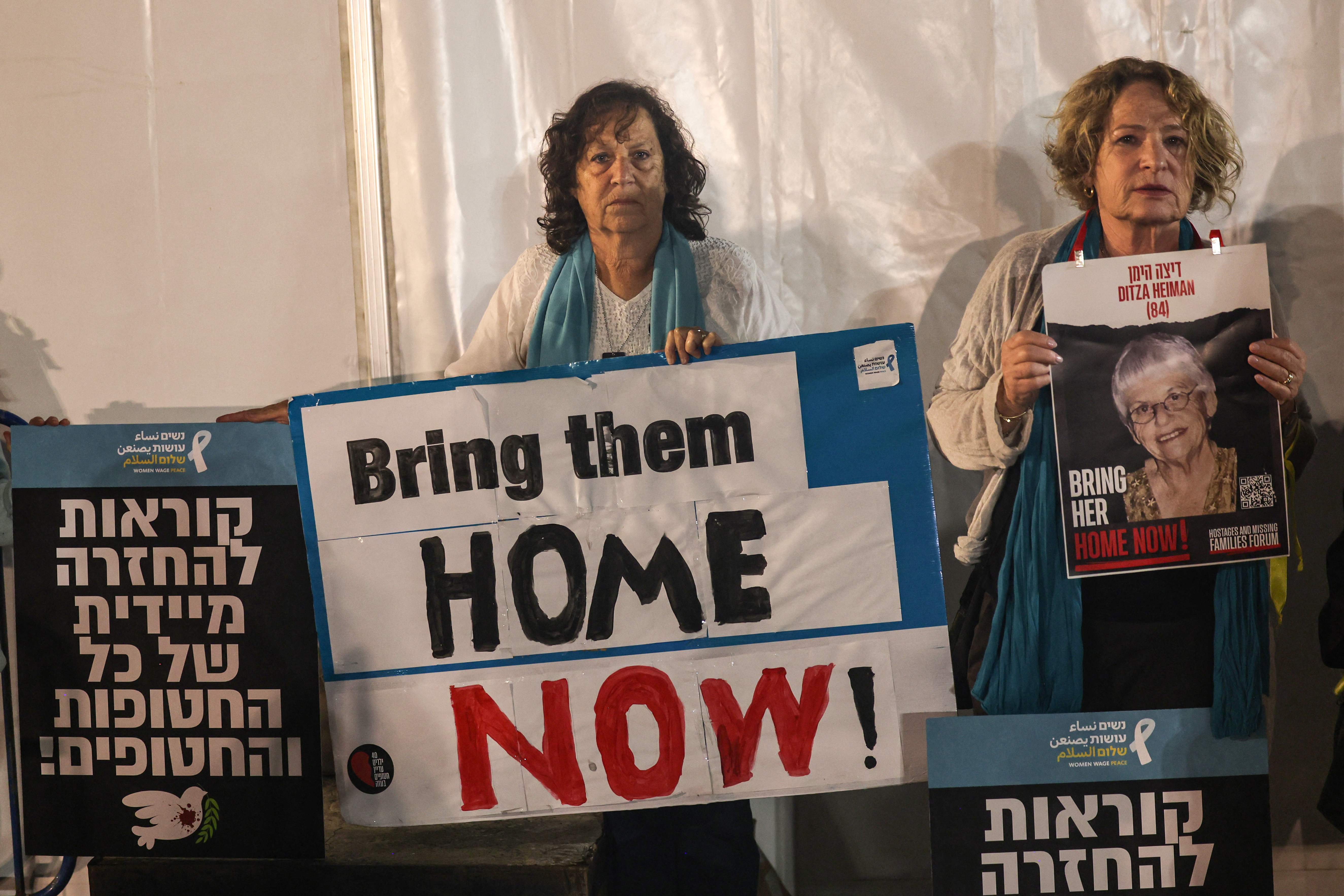 Relatives and friends of Ditza Heiman in Tel Aviv call for her release