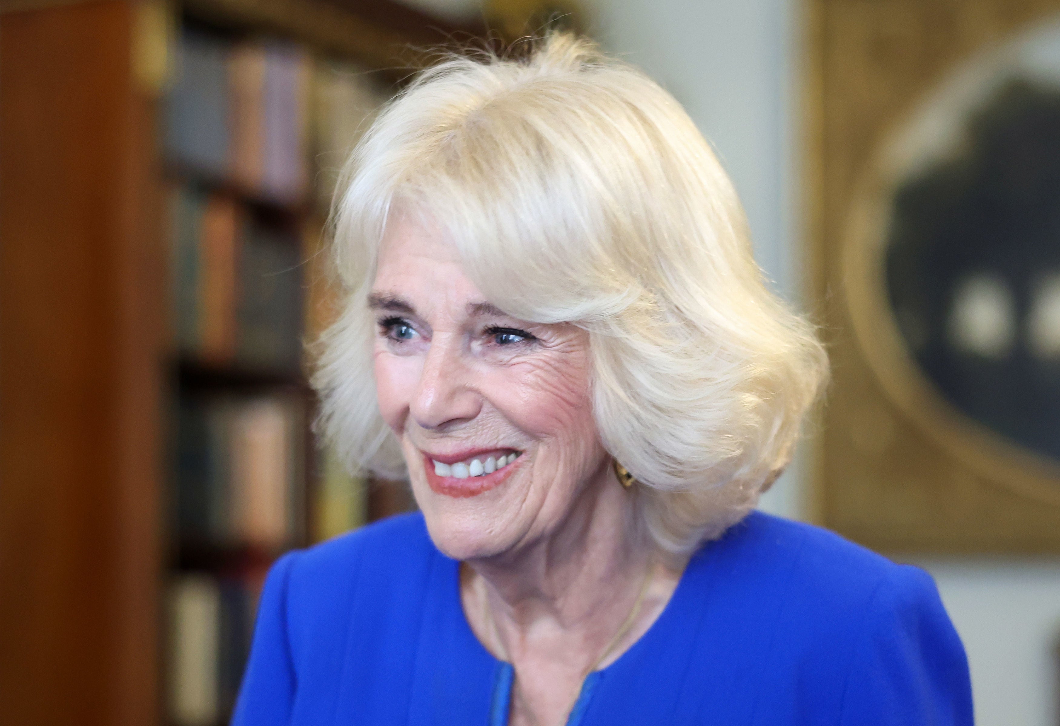 Queen Camilla, patron of the Booker Prize, speaks to guests during a Clarence House reception