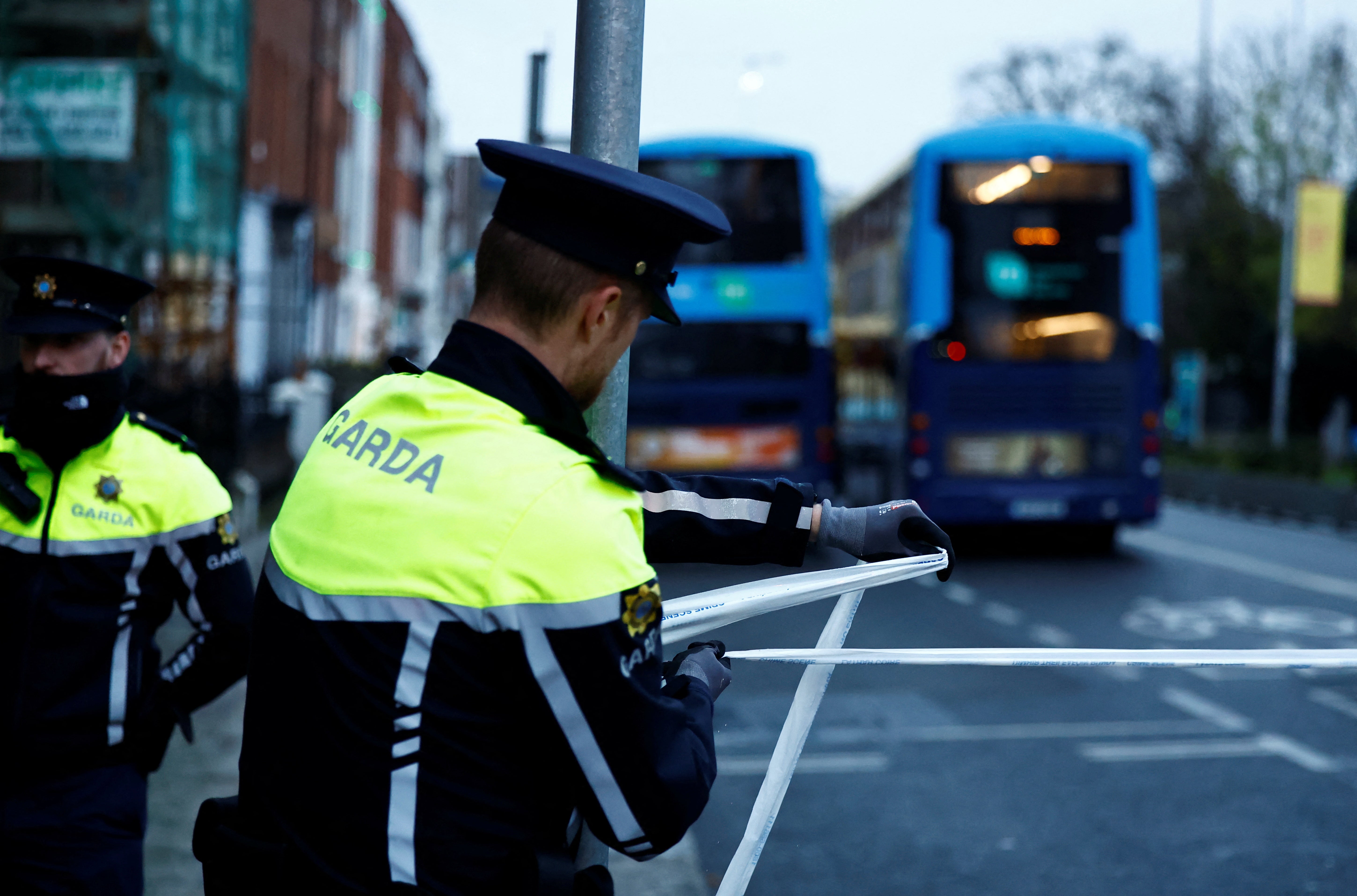 Police officers tape off Parnell Square East shortly after the incident