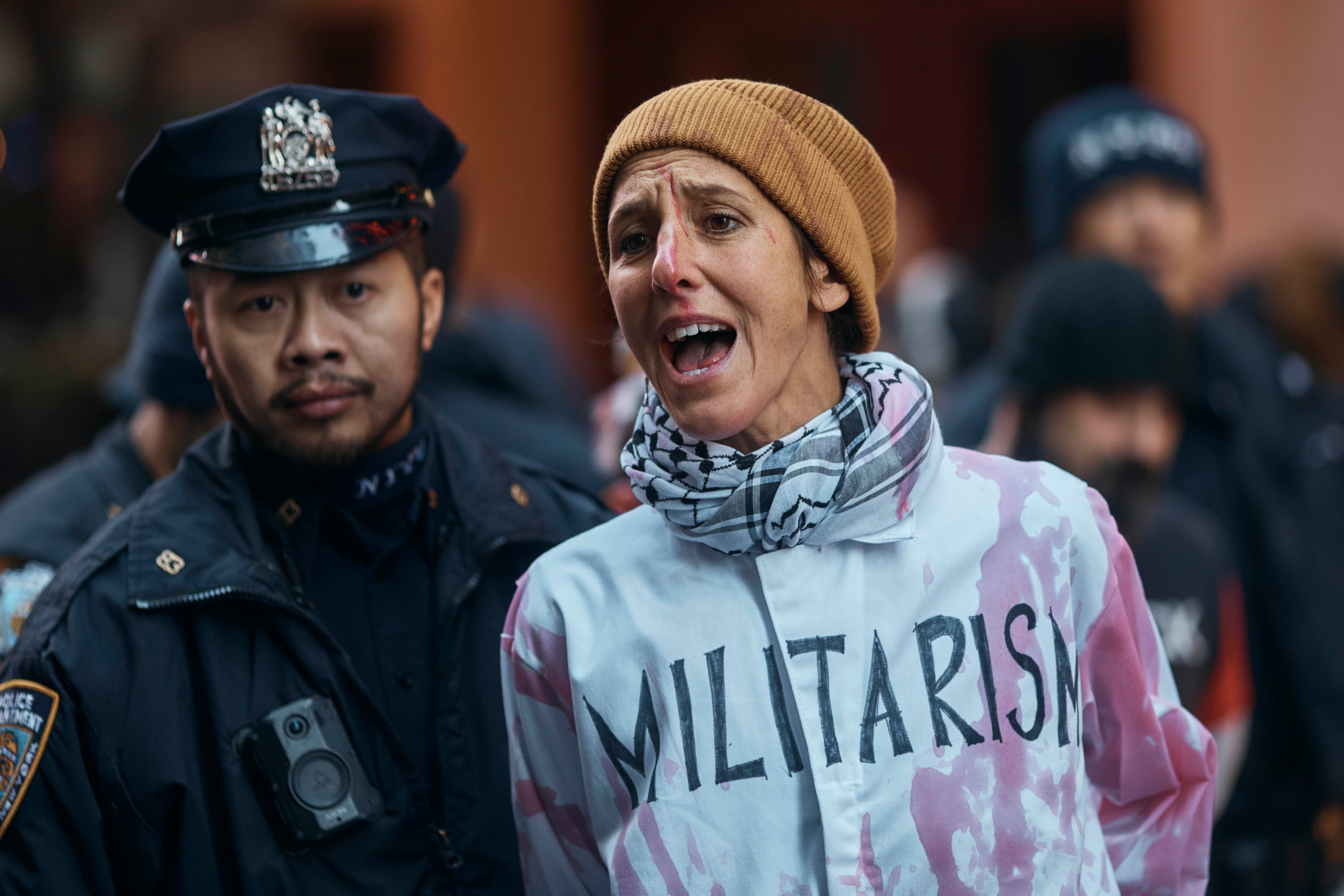 Activists poured fake blood on each other