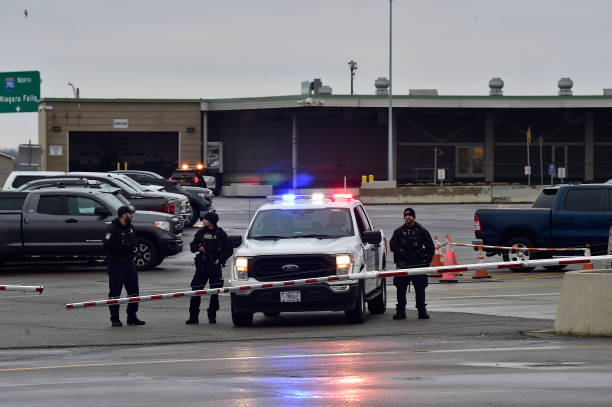 Police stand guard as the Peace Bridge after the crash