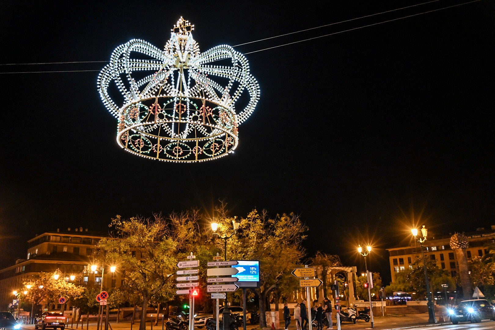 The emperor's crown above Cours Napoleon lights up at night