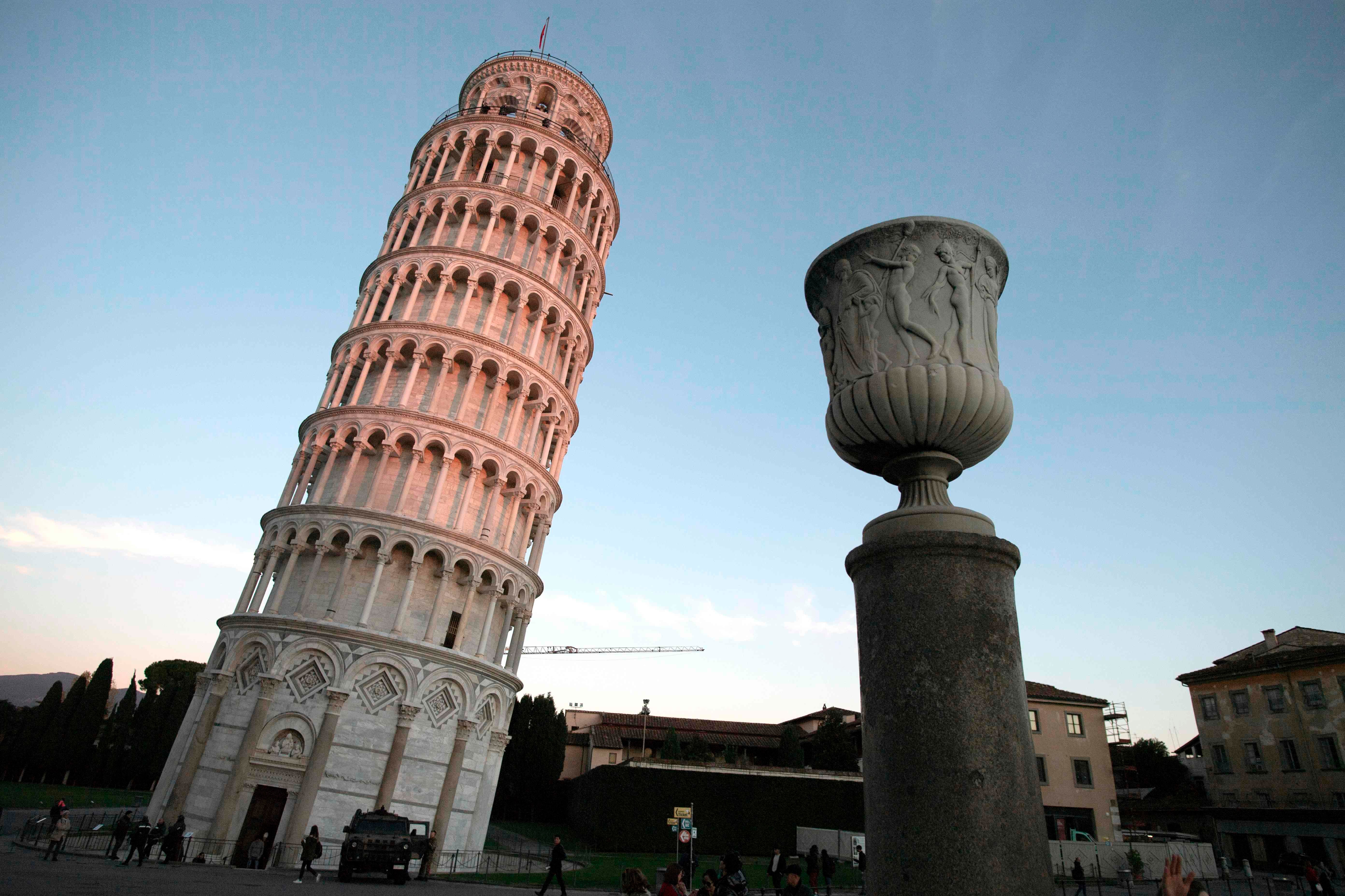 The Garisenda Tower tilts at one degree less than the five degree slant of the leaning tower of Pisa, pictured