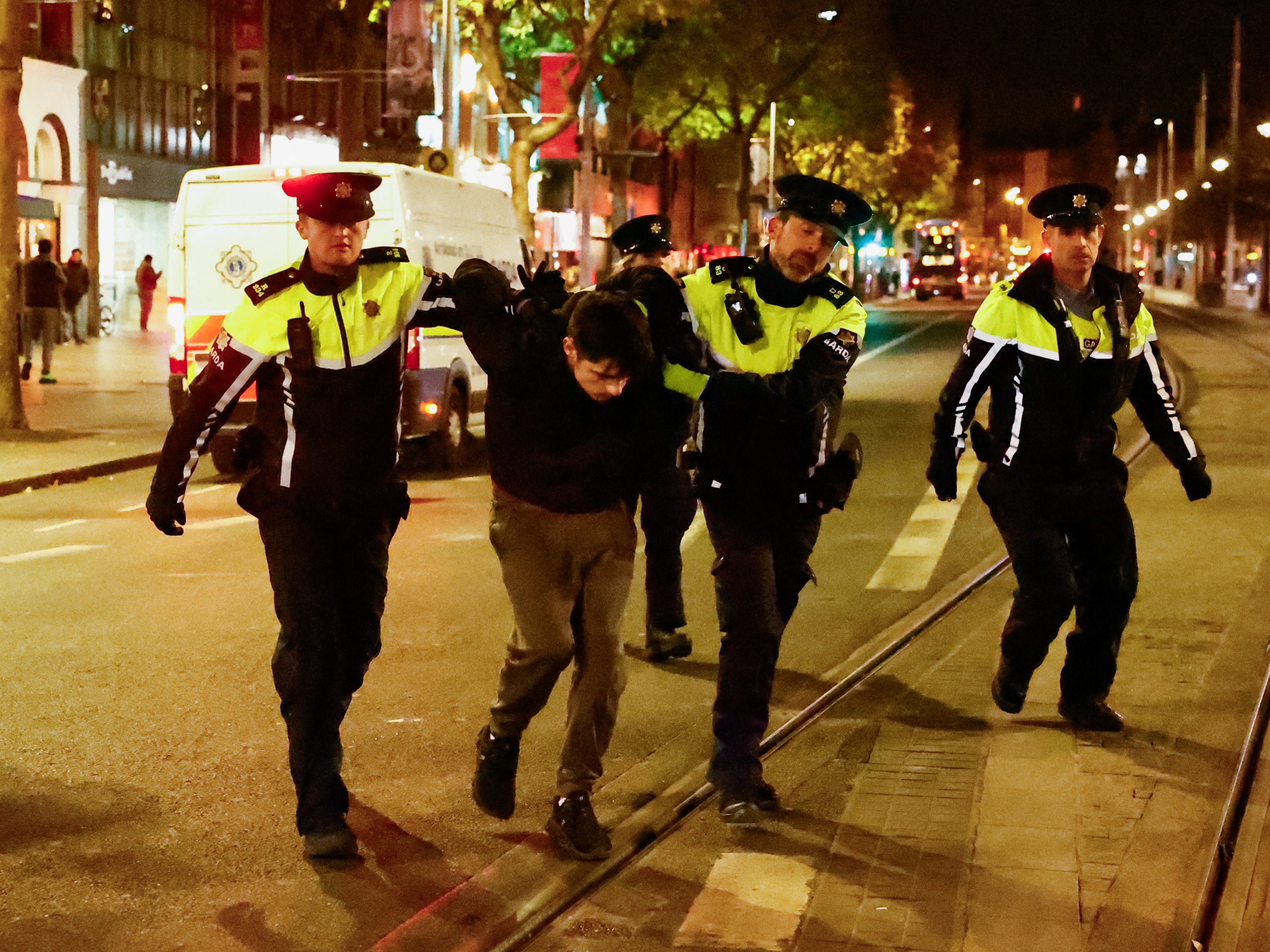 Garda police arresting a man as violent disorder broke out in the city centre